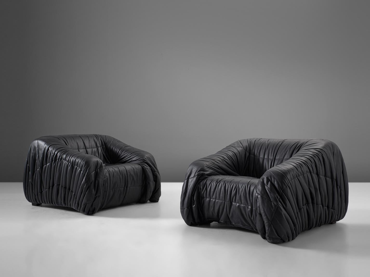 Jonathan de Pas, Donato D'urbino & Paolo Lomazzi for Dell'Oca, 'Piumino' lounge chairs, leatherette, Italy, 1970

These lounge chairs are completely moulded out of foam and covered with folded black, thick but soft leatherette. One of the main