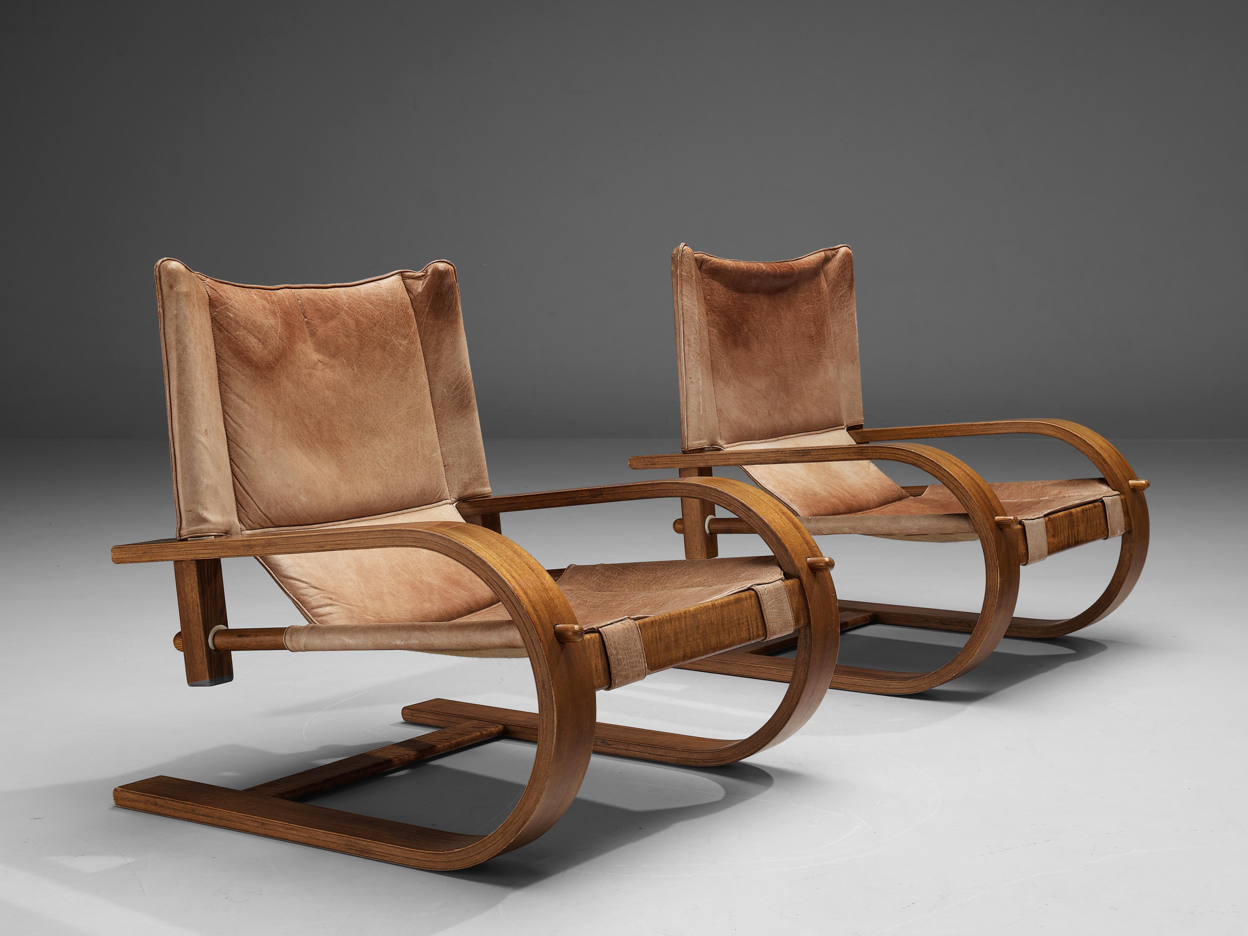 De Pas, D'Urbino and Lomazzi for Poltronova, lounge chairs model 'Scacciapensieri', leather, wood, Italy, 1960s

Cantilevered Italian lounge chairs with organically shaped frame. The frame features wonderful connective details that reveal the