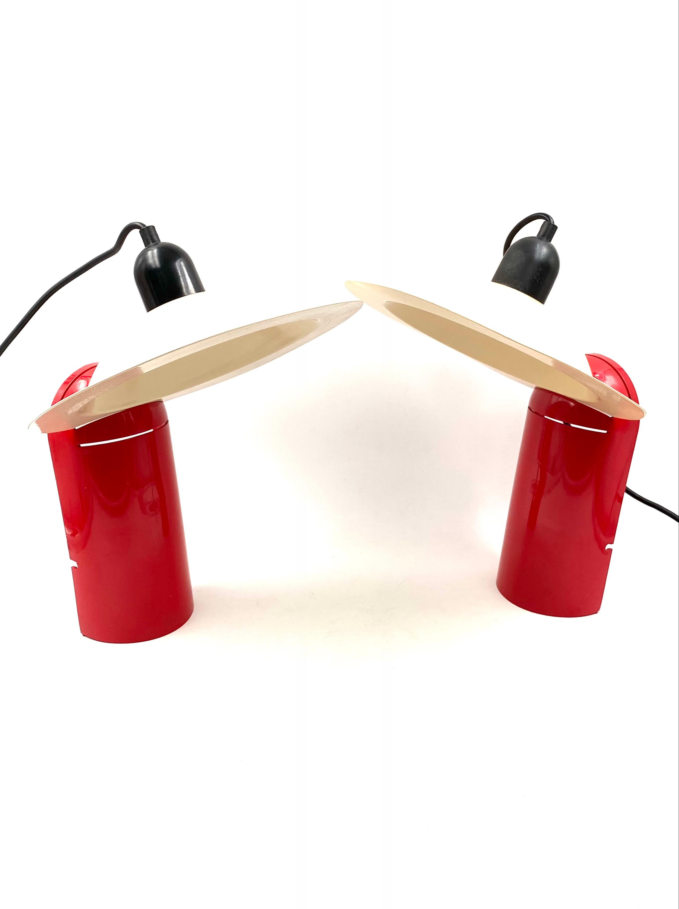 Designed by De Pas D'urbino Lomazzi for Stilnovo in 1971. This couple come from 1970s.

Red model. There is no mechanical parts : no hinge, gear or motor.

Not later production. Production period: 1970 from 1979

The lampshade is white