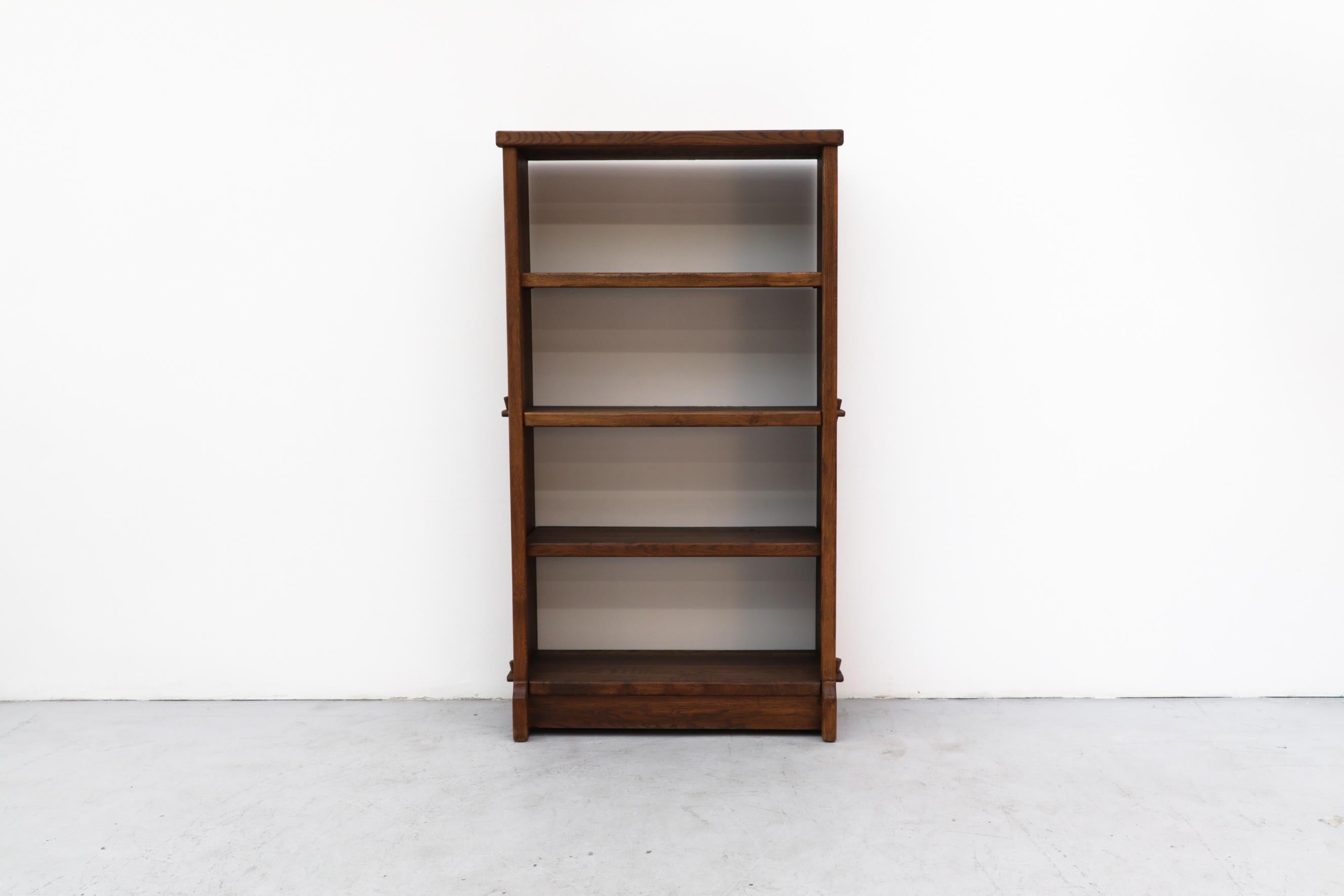 Large Brutalist oak unit with 4 shelves. In original condition with wear that's consistent with its age and use. Other standing shelving units are available and listed separately (LU922428505192).