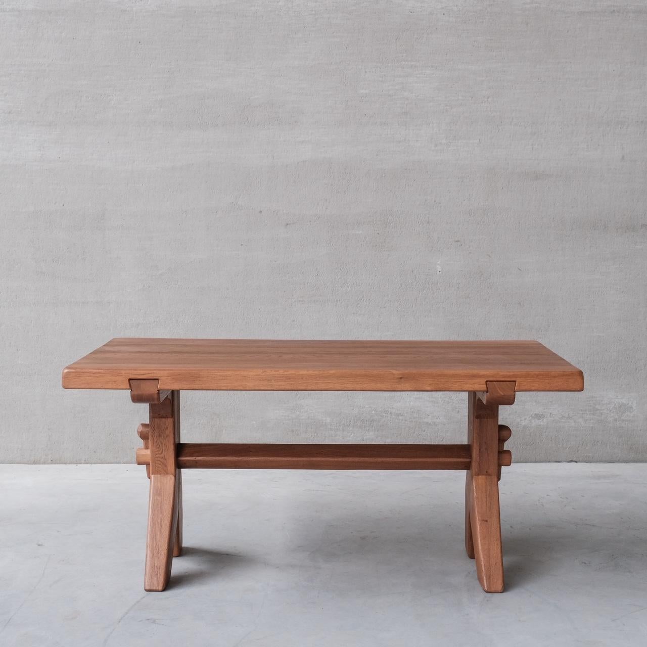 A brutalist dining table by De Puydt. 

Belgium, c1970s. 

Solid oak. 

Plenty of character, and exposed joints. 

Some wear commensurate with age, but generally good condition. 

Location: Belgium Gallery. 

Dimensions: 160 W x 84 D x