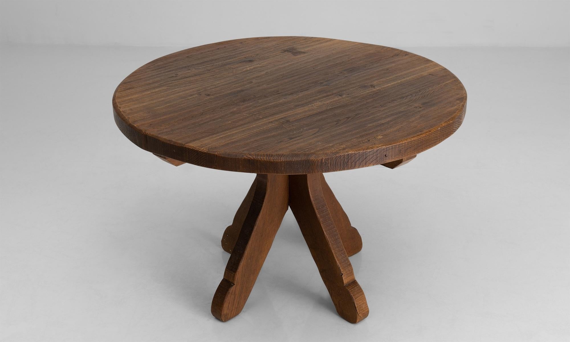 De Puydt round dining table

Belgium circa 1970

Constructed in thick planks of oak with dovetail joinery.

Measures: 46” diameter x 29.75” height.