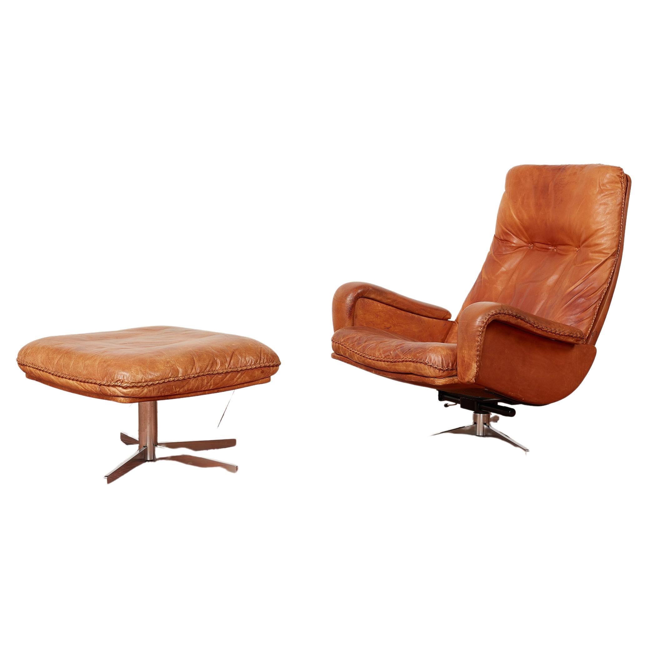 Leather lounge chair with matching ottoman by De Sede, Switzerland circa 1960s
Great soft caramel leather with signature whipstitching
Matching swivel bases and curved arms.



