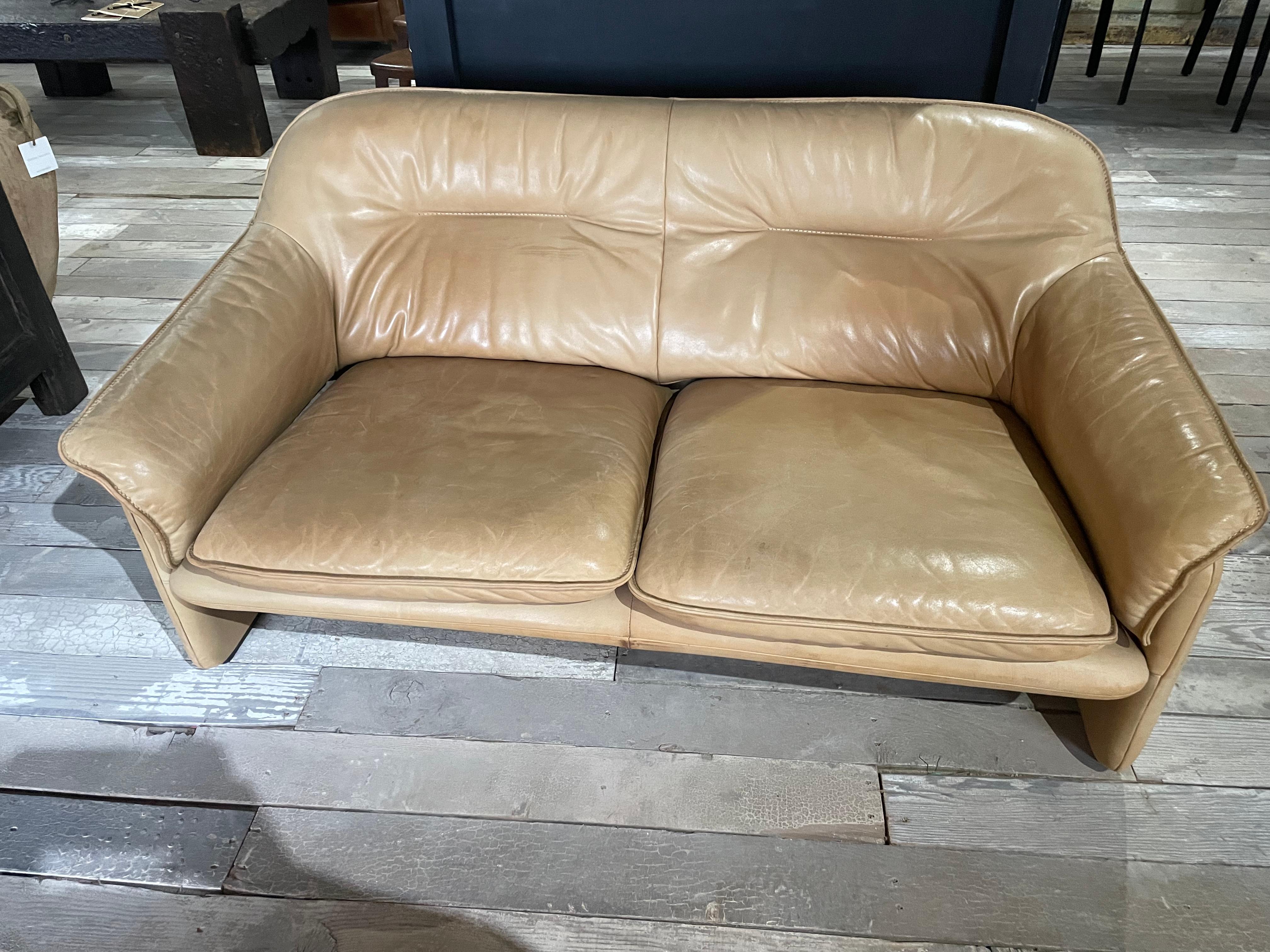 An iconic mid century design, this De Sede incredible 2 seat sofa/loveseat is no longer in production making it a collectible piece from the furniture manufacturer. Even though this a 2 seat sofa it feels much wider when 2 people are sitting in it