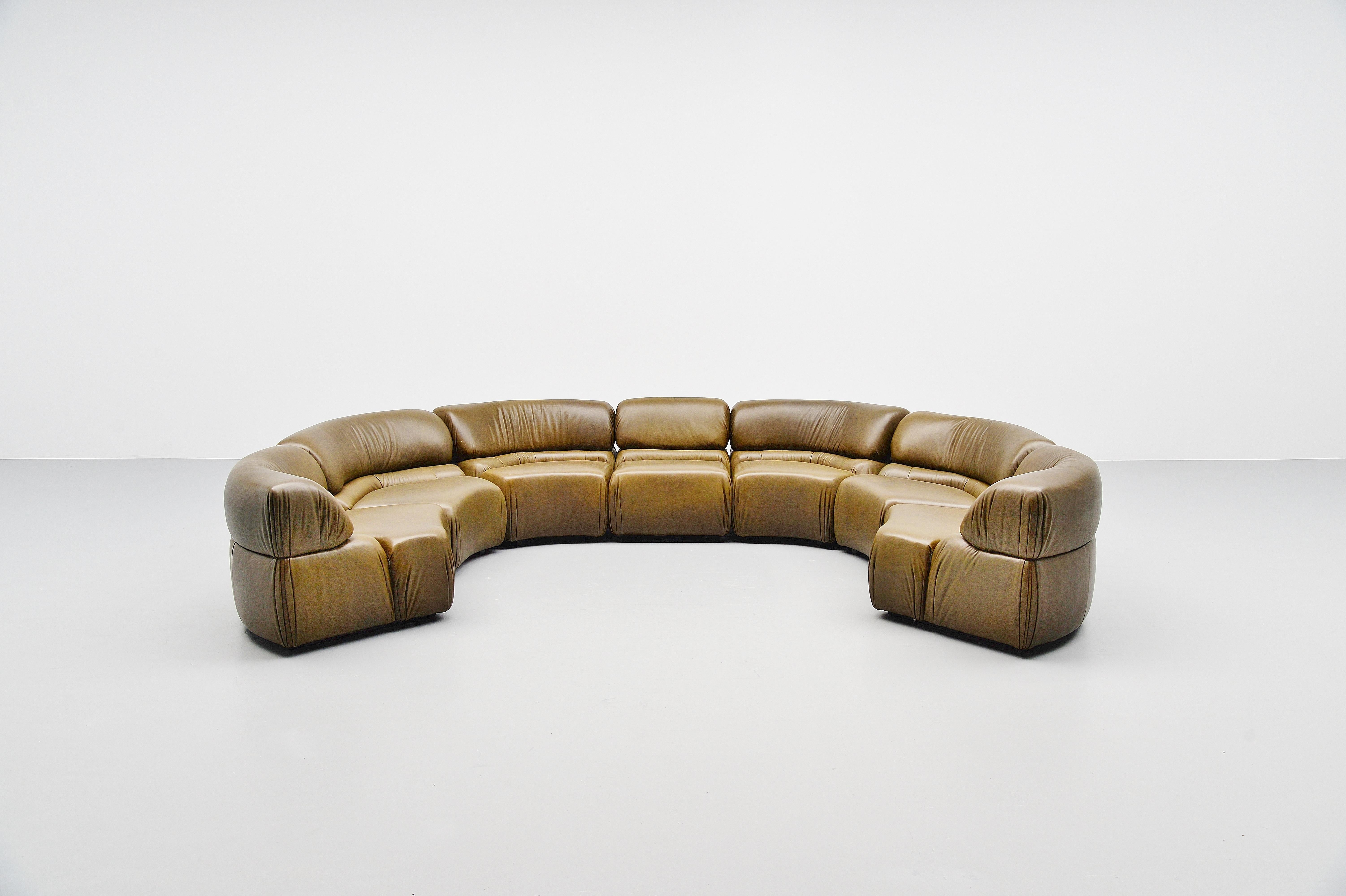 Spectacular an very comfortable so called ‘Cosmos’ elemented sofa designed and manufactured by De Sede, Switzerland, 1970. This sofa has a wooden structure filled with foam and covered with olivegreen buffalo leather. The sofa is in very nice olive