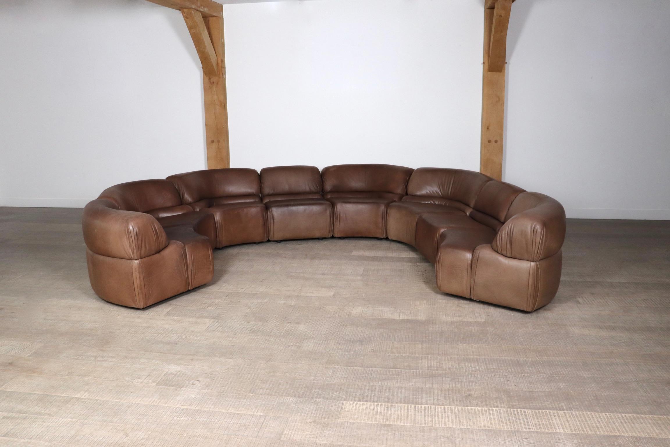Beautiful Sede DS-28 Cosmos sectional sofa, Switzerland 1970s. This chunky, yet organic sofa consists of 8 modular elements, of which 6 are angular and two are straight. This set has its original light brown buffalo leather with nice overall patina.