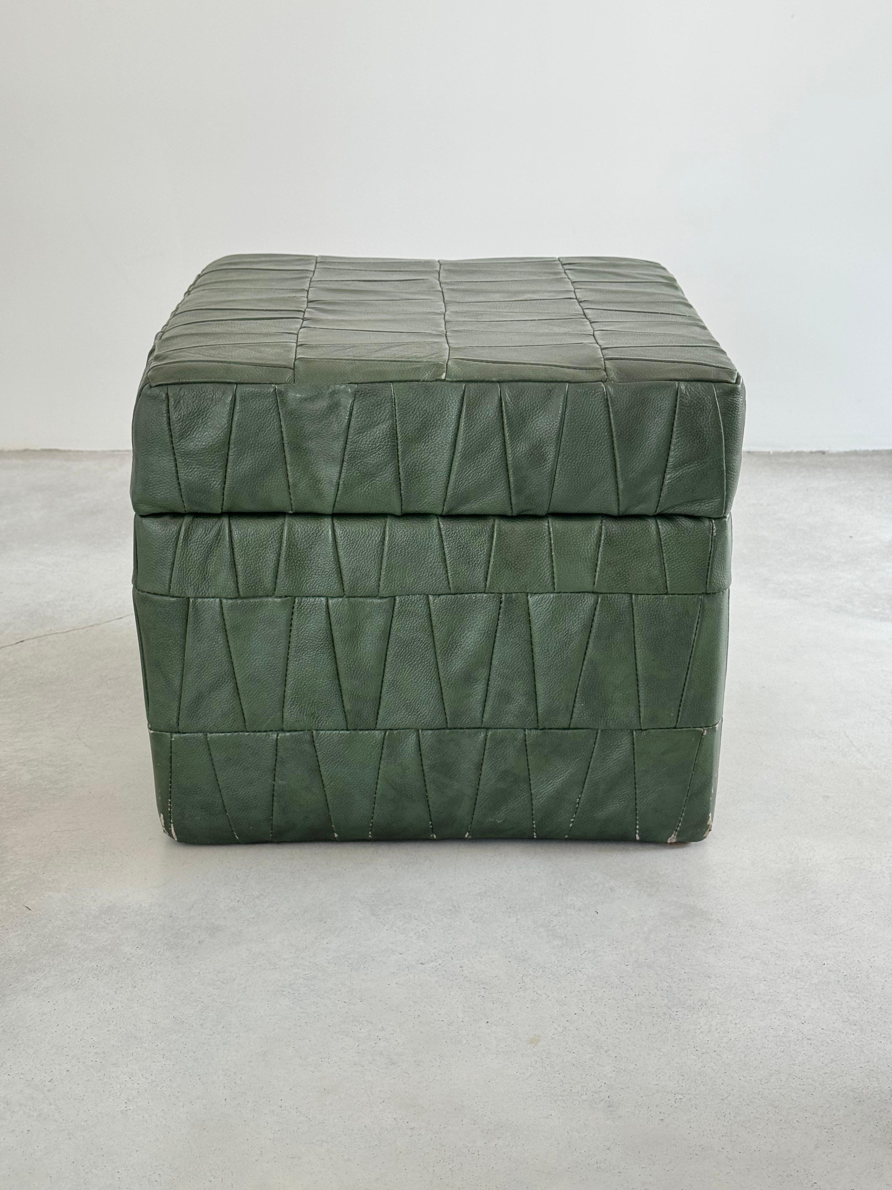 Dark green patchwork leather storage ottomans with open top by Swiss designer De Sede. 

Original soft leather with beautiful patina.

Good condition. Leather wear on 3 corners (see photos).
1970s.

Many colors and sizes available, check out my