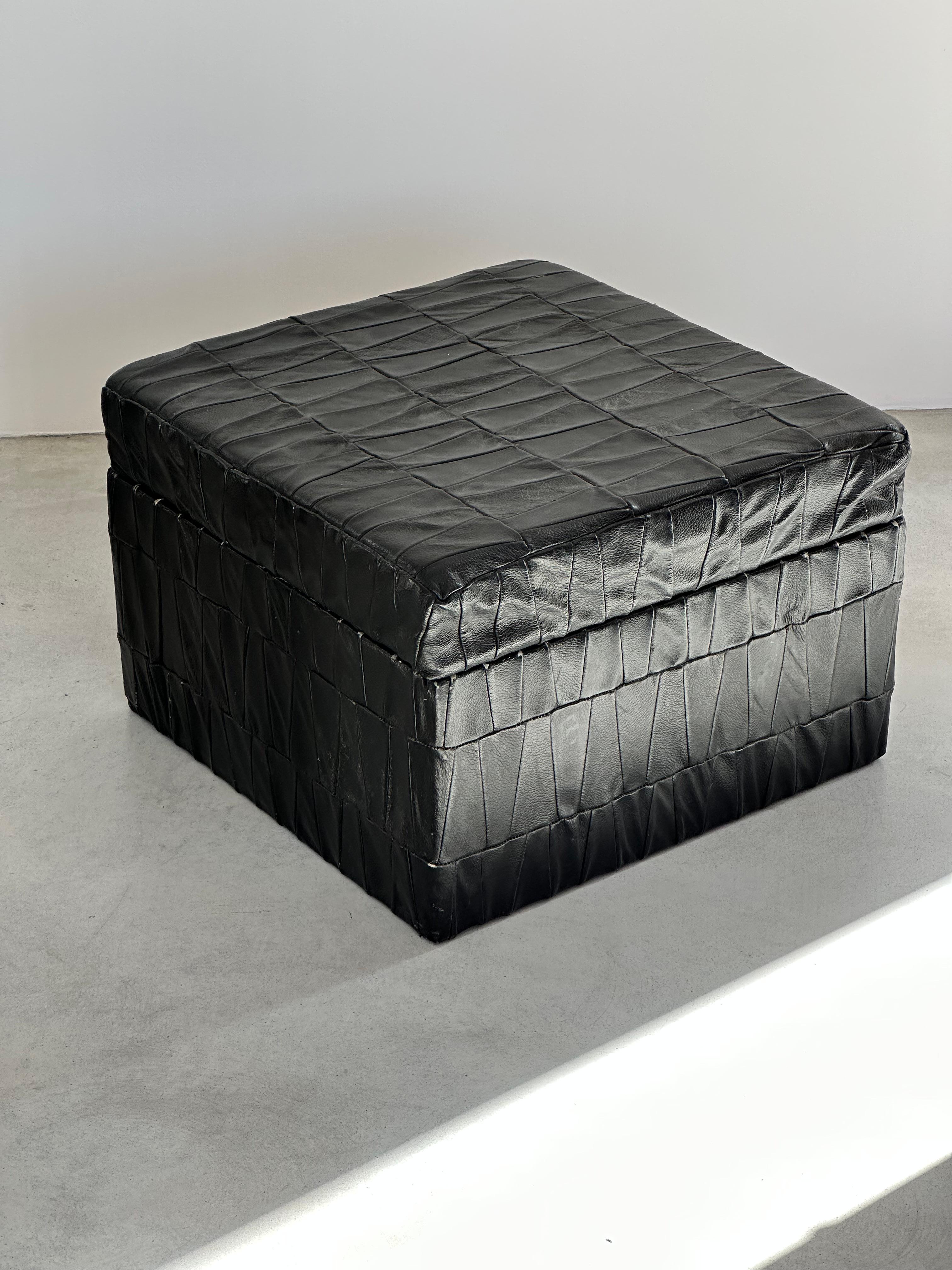 Black patchwork leather storage ottomans with open top by Swiss designer De Sede. 

Original soft leather with beautiful patina.

Good condition.

1970s.

Many colors and sizes available, check out my other items.
de Sede has its origins in a small