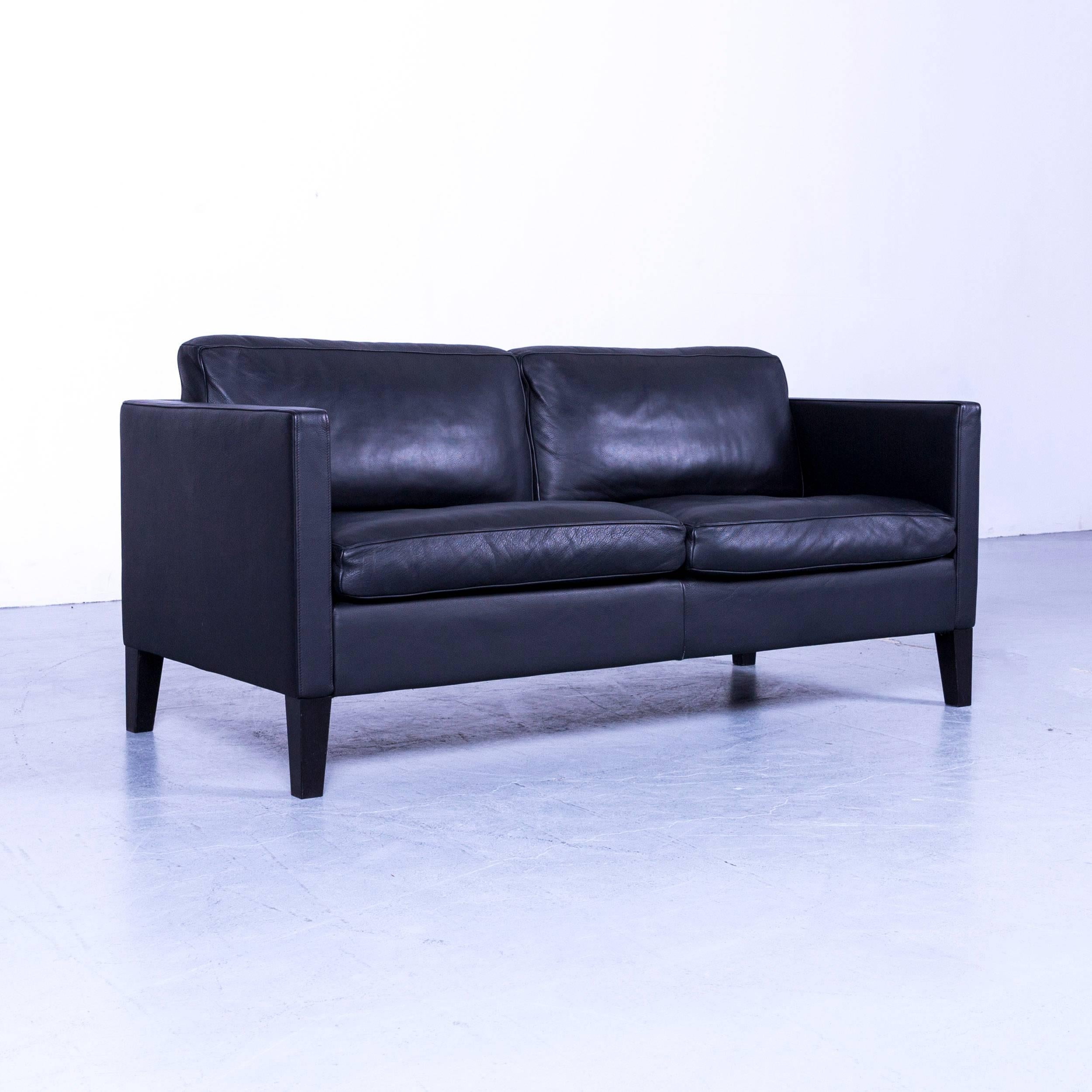 Black colored original De Sede designer leather sofa in a minimalistic and modern design, made for pure comfort and flexibility.