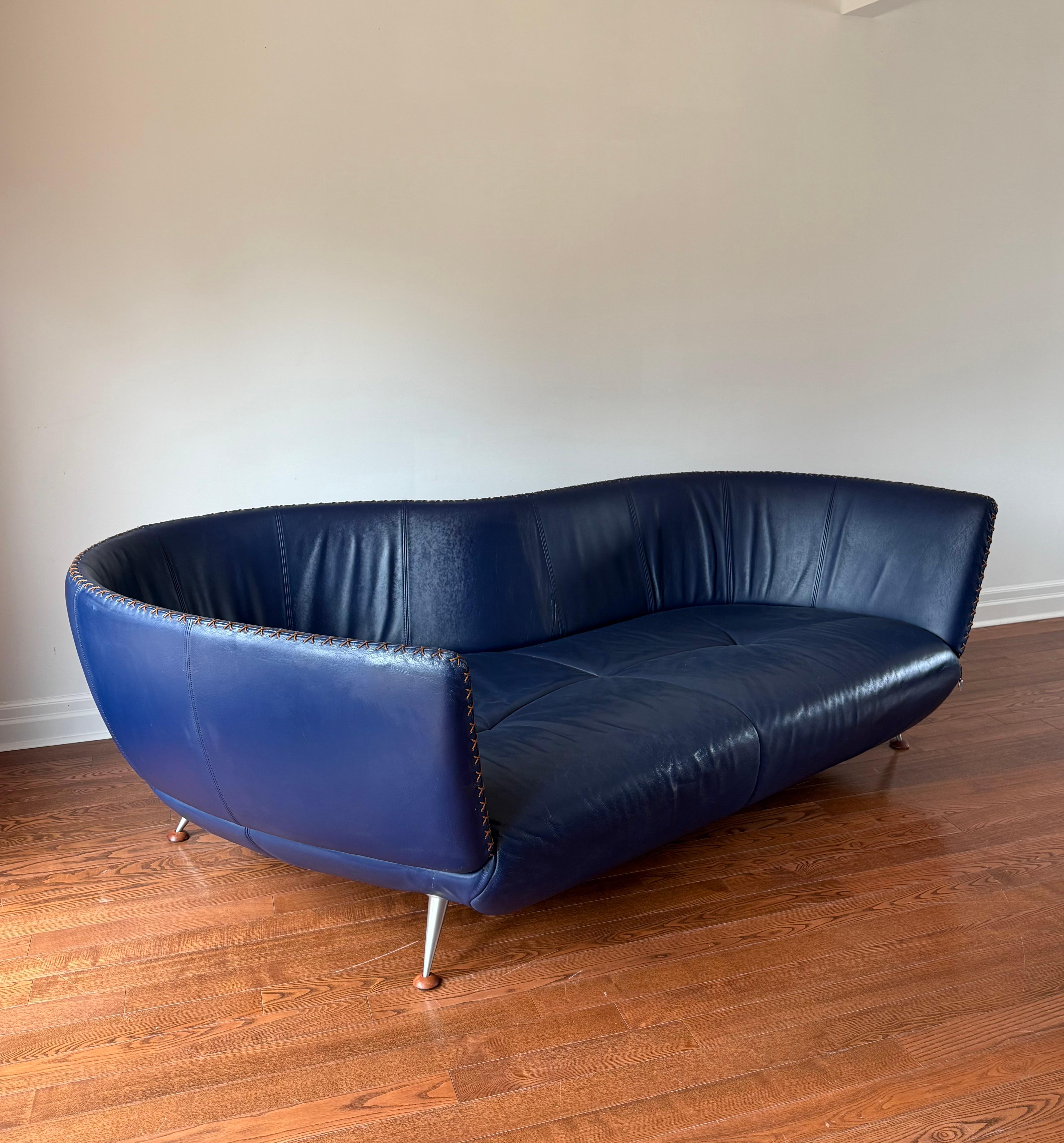 Design care of Matthias Hoffman for Swiss, De Sede. Thick navy top grain leather upholstery has been deep cleaned and conditioned. Upholstery is in good condition sub scratches to seated area - sofa comes from a home with a pet. Sofa has been re
