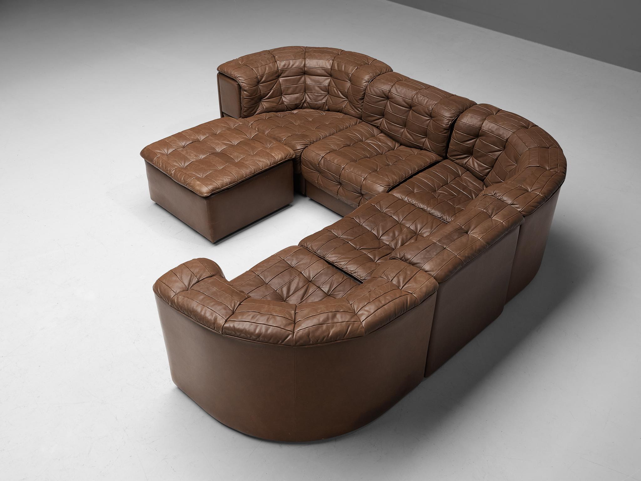 De Sede, 'DS-11' sectional sofa and ottoman, leather, Switzerland, 1970s.

This high-quality sectional sofa designed by De Sede in the 1970s contains two regular elements, three corner elements, and an ottoman, making it possible to arrange this