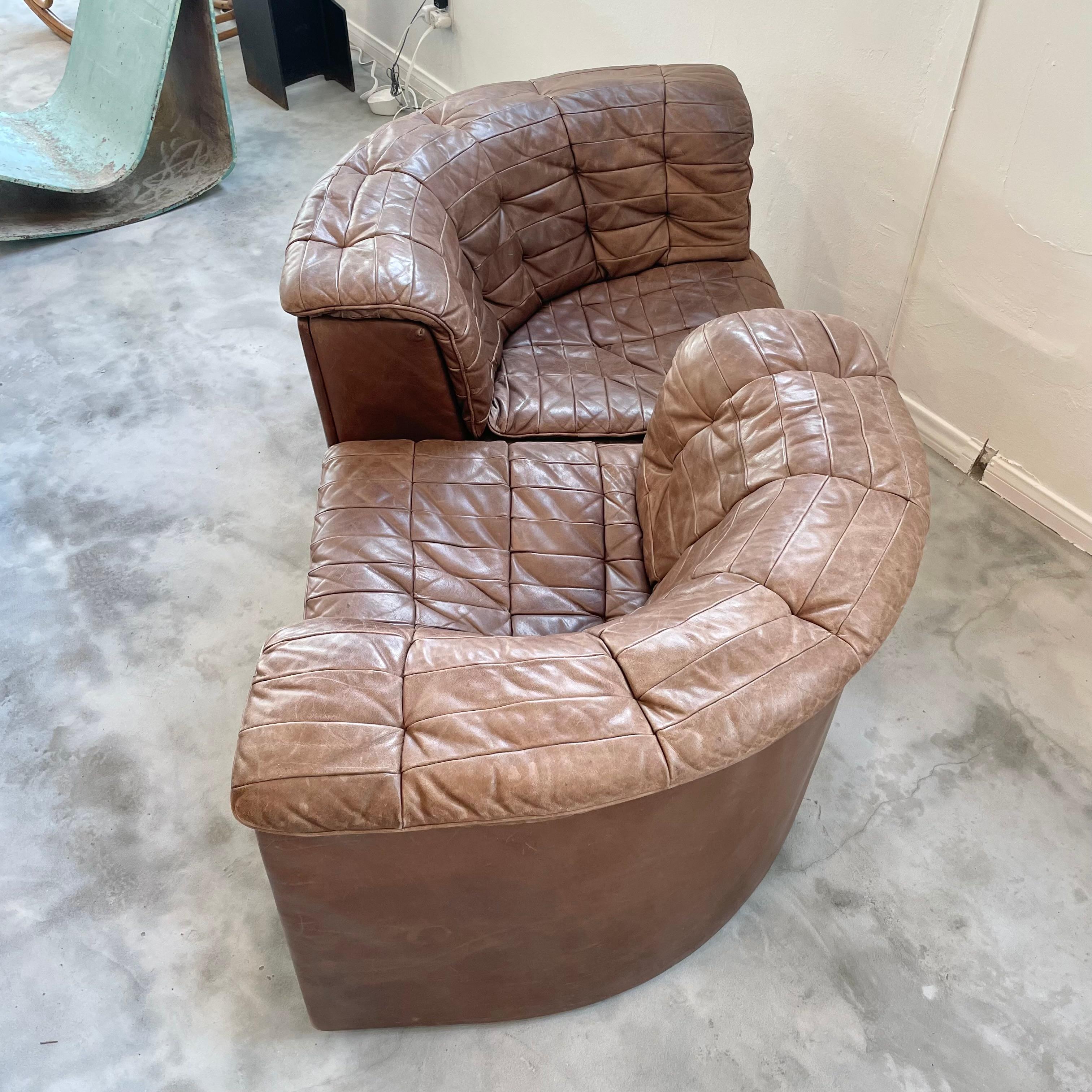 Incredible DS 11 sofa by De Sede. This set is made up of two corner pieces in a buttery soft chocolate brown leather. The two corner pieces are able to be arranged in a variety of ways which makes this piece very versatile and fun. Intricate