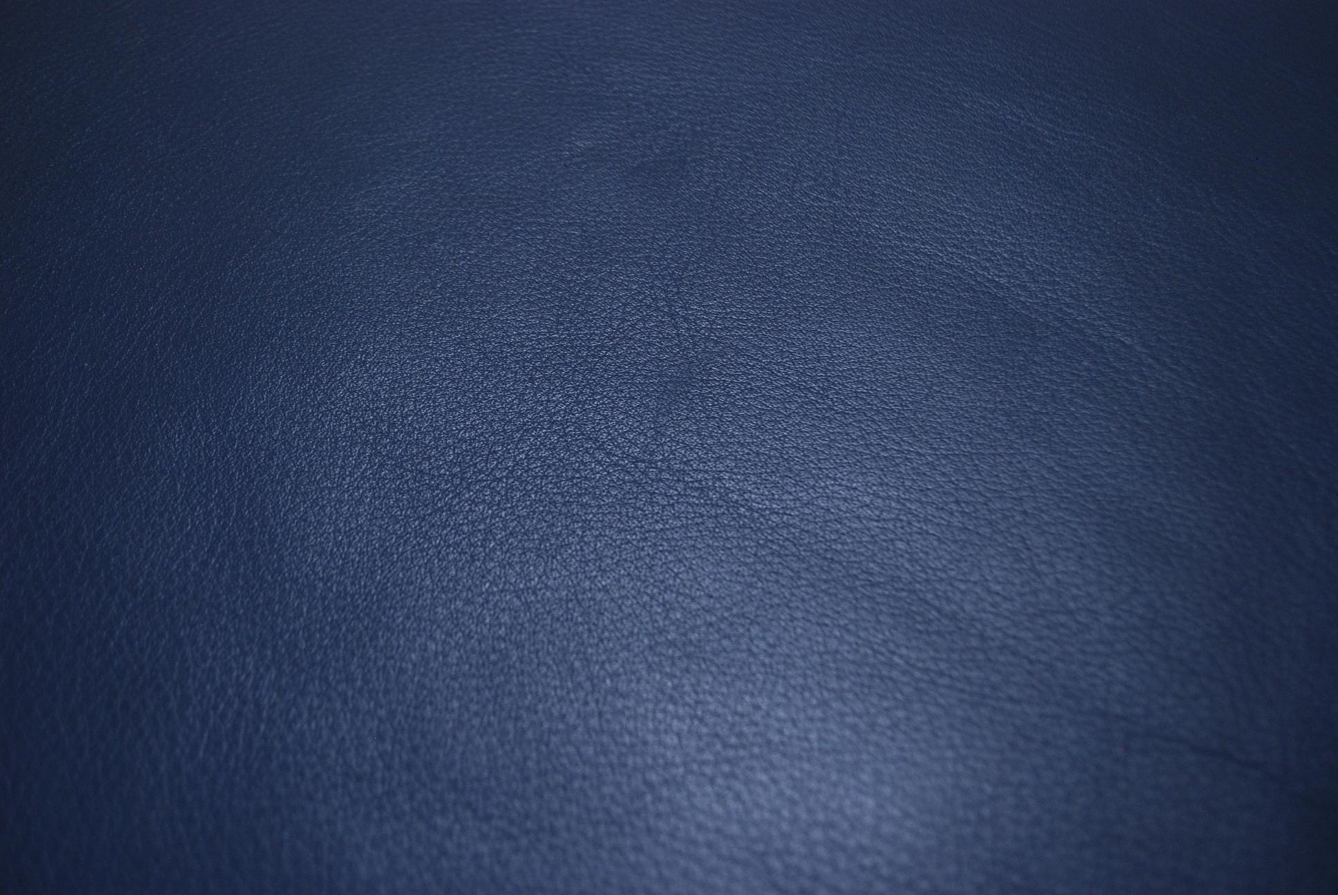 blue leather pouf