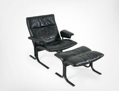De Sede DS-2030 Black Leather Armchair and Footstool by Hans Eichenberger