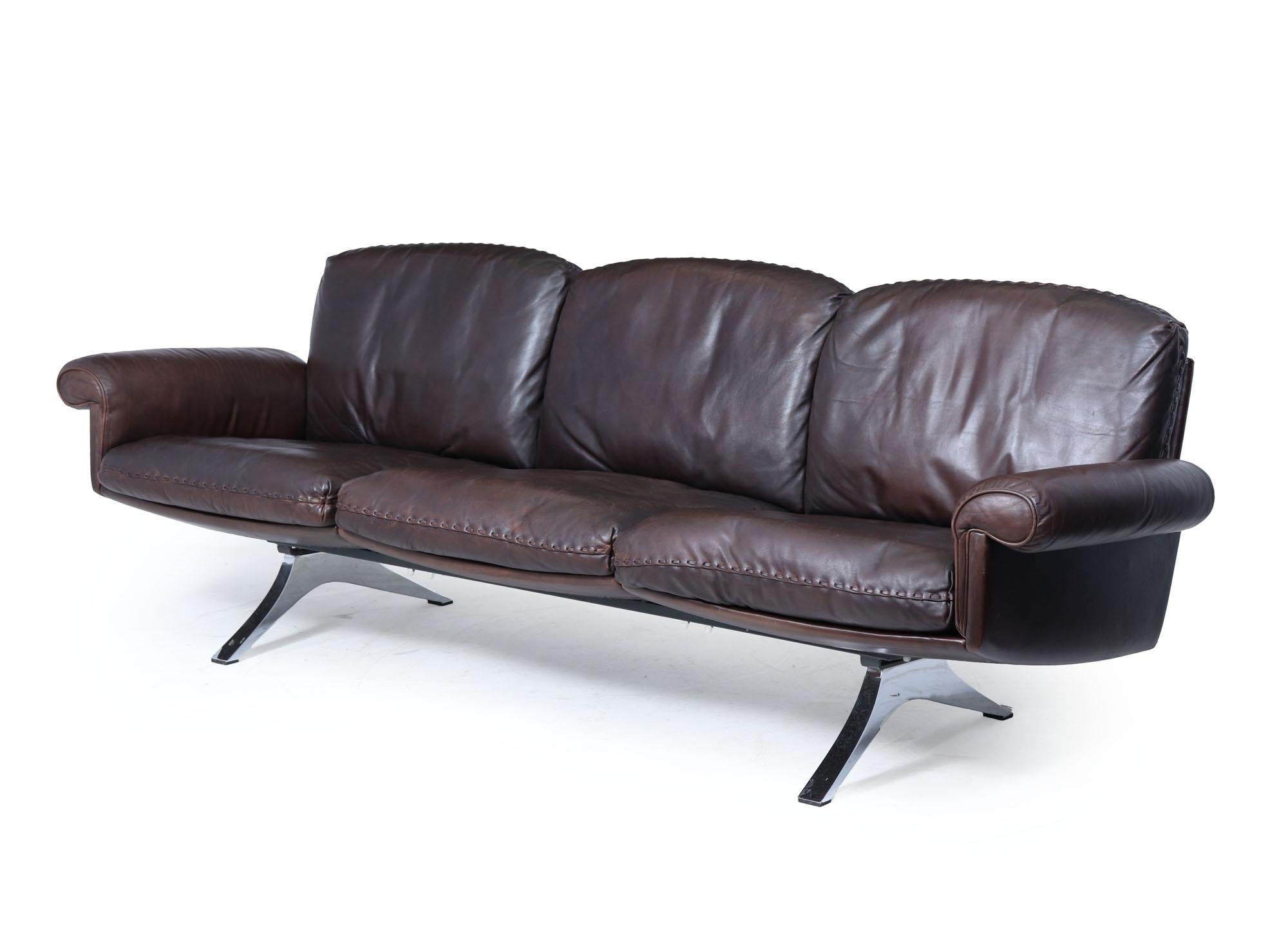 De Sede DS-31 Sofa
A beautifully proportioned De Sede DS-31 three-seater sofa, upholstered in supple dark brown leather and supported by sculptural polished chrome legs. Designed and made in Switzerland in the 1970s, the DS-31 range is renowned for