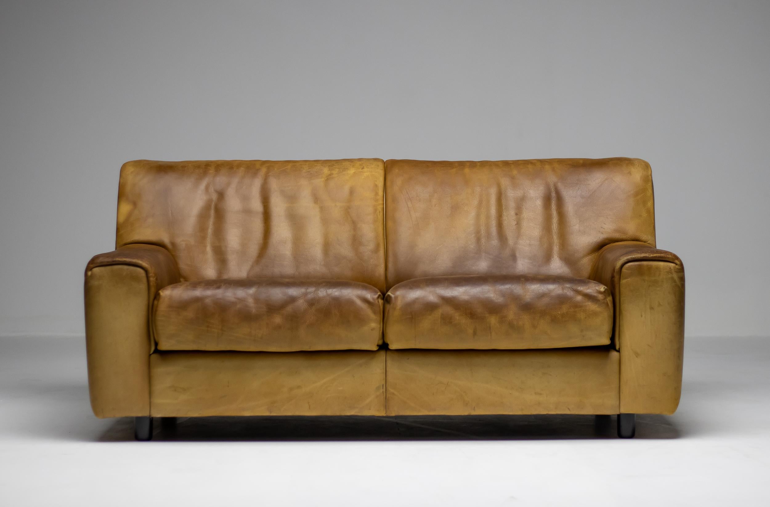 Very comfortable De Sede DS-42 sofa in thick buffalo neck leather, Switzerland, 1970s. 
The design is basic, yet very modern. The very thick high quality leather is in nice vintage condition and is packed with character and patina. 

De Sede once