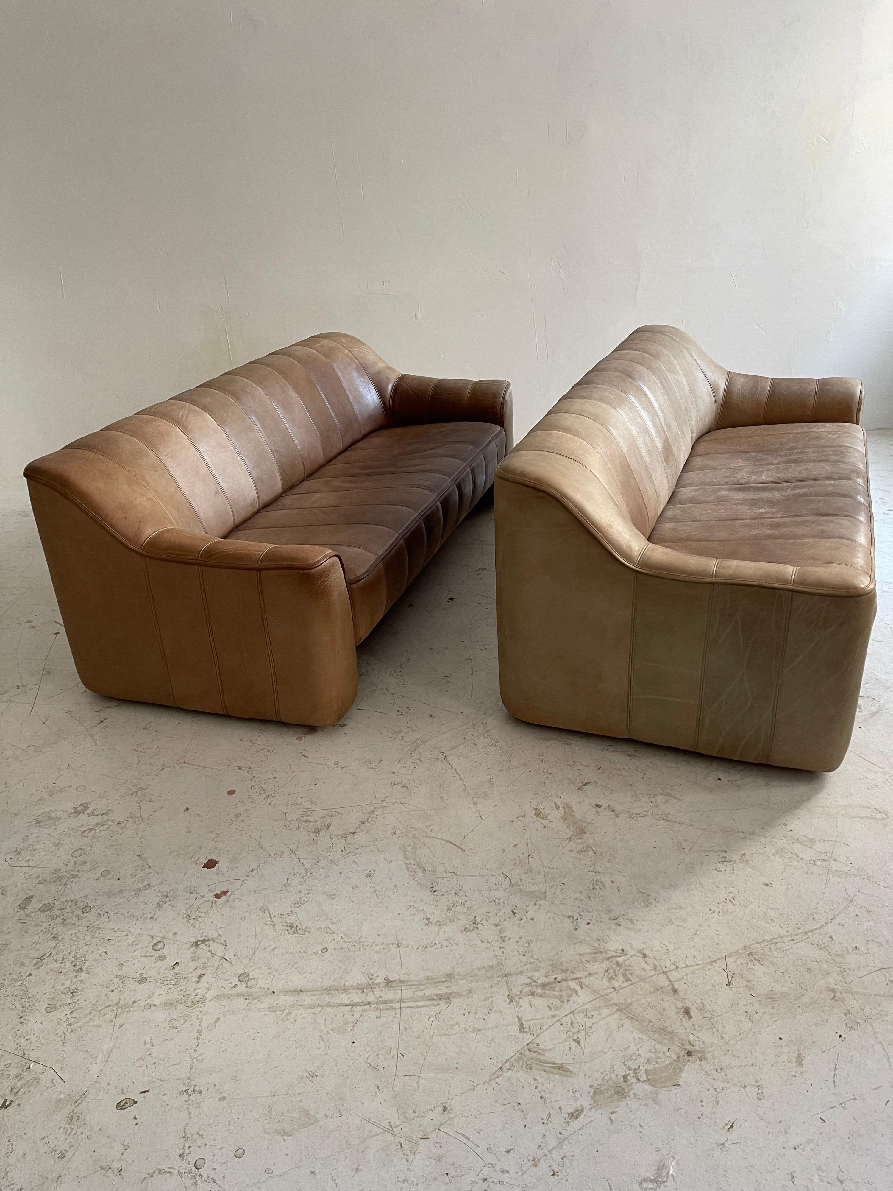 De Sede DS-44 pair sofa's in patinated cognac buffalo leather, Switzerland 1970. Rare to find pair in beautifully patinated condition.