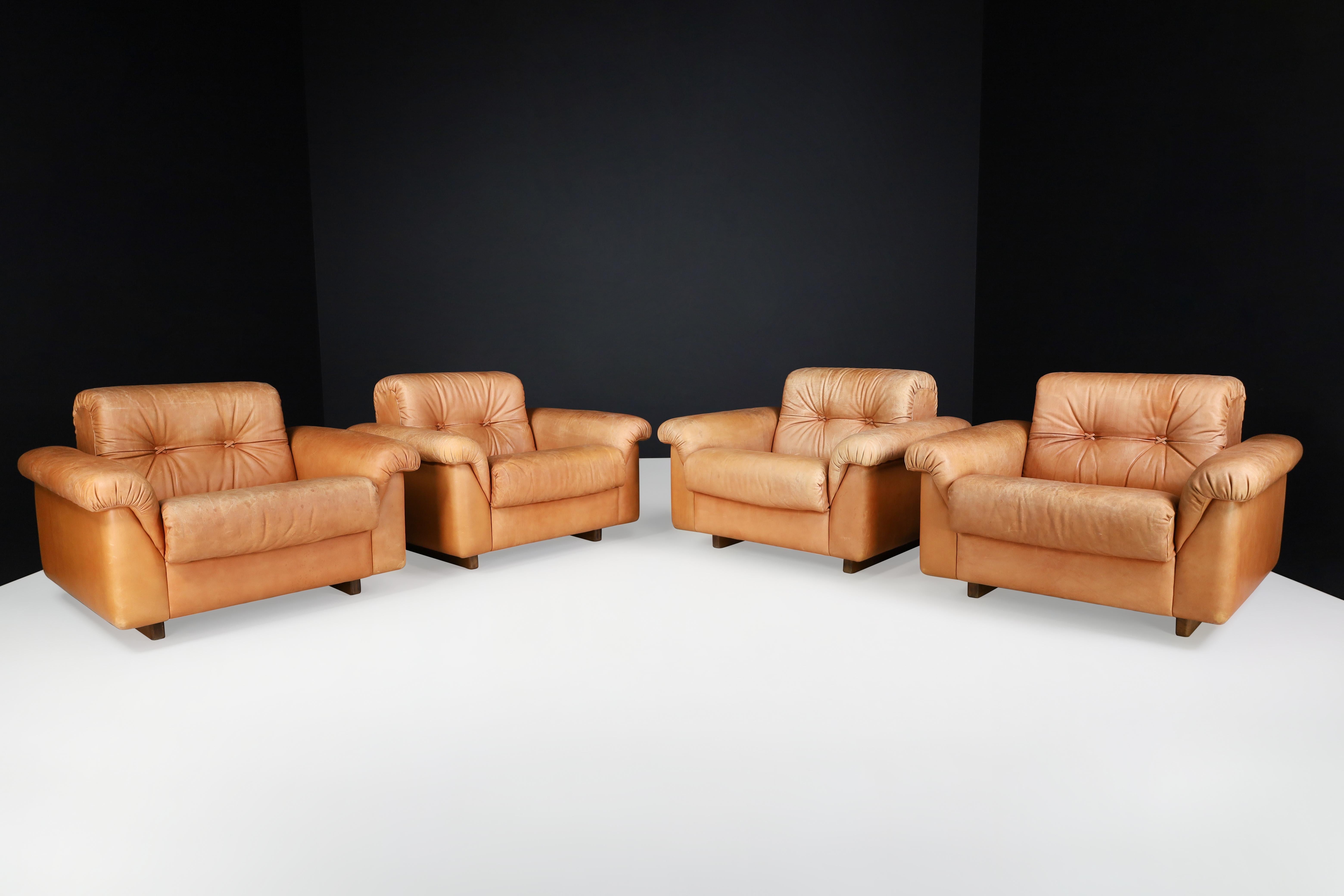 De Sede DS 45 lounge chairs in patinated leather, Switzerland, 1970s.

Robust set of four DS-45 patinated leather lounge chairs. These De Sede lounge chairs ensure ultimate comfort and building quality with their solid wooden frame and thick