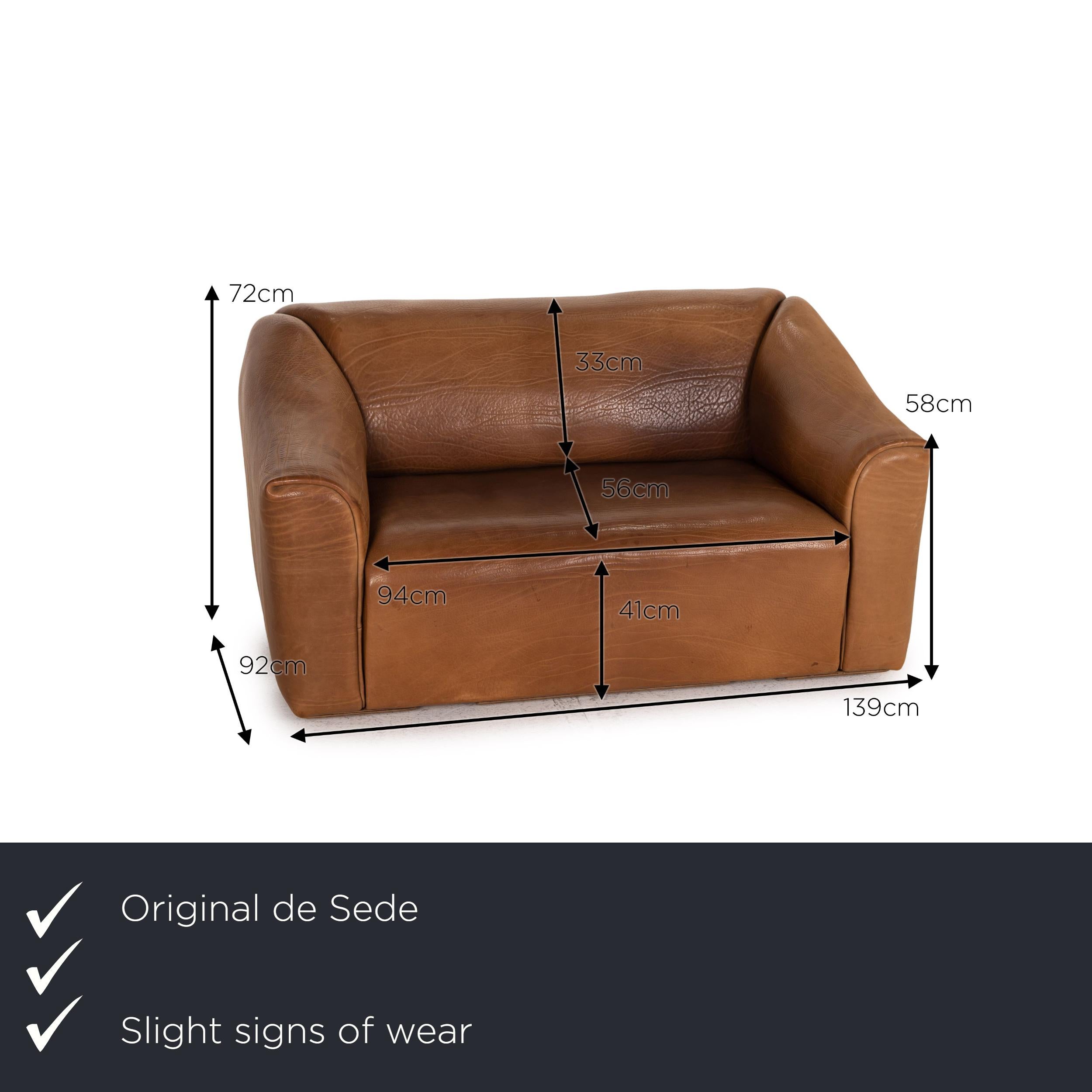 We present to you a de Sede DS 47 leather sofa brown two-seater function vintage couch.
  
 

 Product measurements in centimeters:
 

 depth: 92
 width: 139
 height: 72
 seat height: 41
 rest height: 58
 seat depth: 56
 seat width: