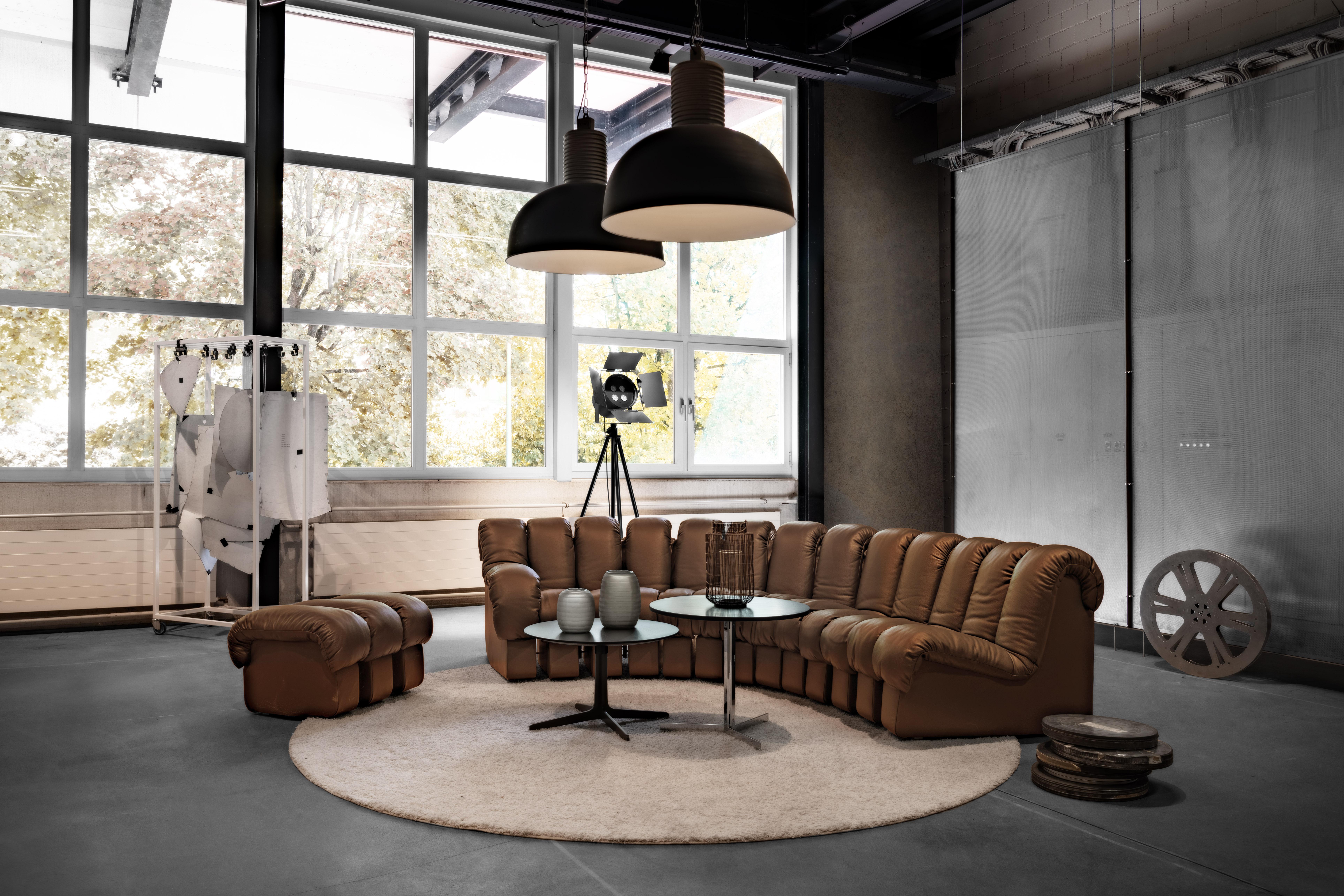 Launched in 1972, DS-600 is an indestructible, variable modular system of upholstered furniture consisting of individual, addable armchair elements. These consist of an L-shaped hard foam core covered with a down-lined and leather-covered cushion.