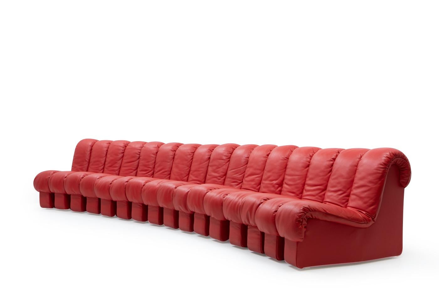 De Sede DS-600 “Non-Stop” or “Tatzelworm” modular sofa model in red leather.

This large modular sofa consists of 16 pieces, and was designed by Ueli Berger and Eleonore Peduzzi-Riva, Klaus Vogt and Heinz Ulrich. Considering the condition and color