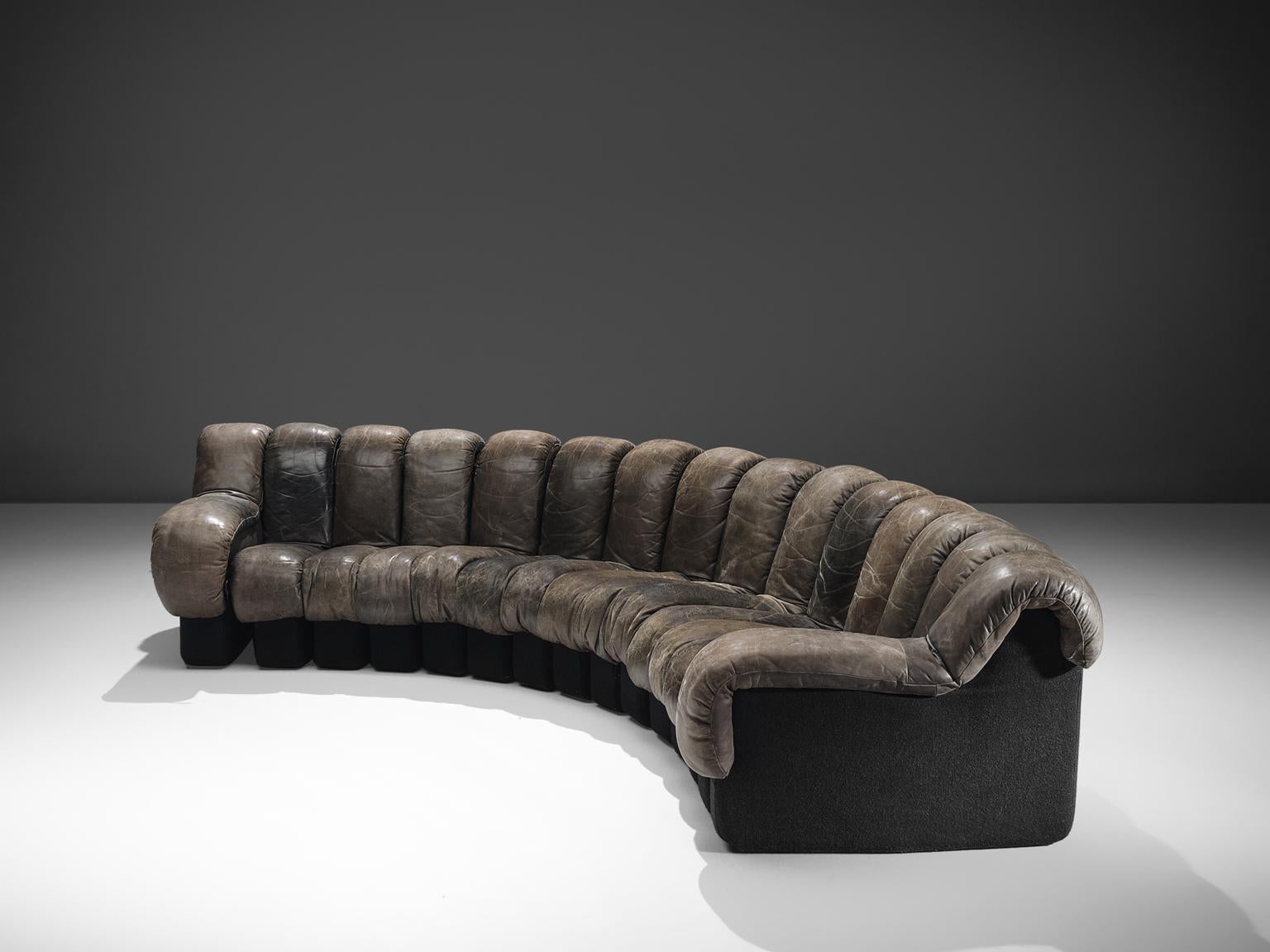 De Sede ‘Snake’ DS-600, 15 elements, dark grey leather, Switzerland, 1972. 

De Sede 'Non Stop' sectional sofa containing 15 pieces in original antracite colored leather, of which two are higher armrests. Any number of pieces can be zipped