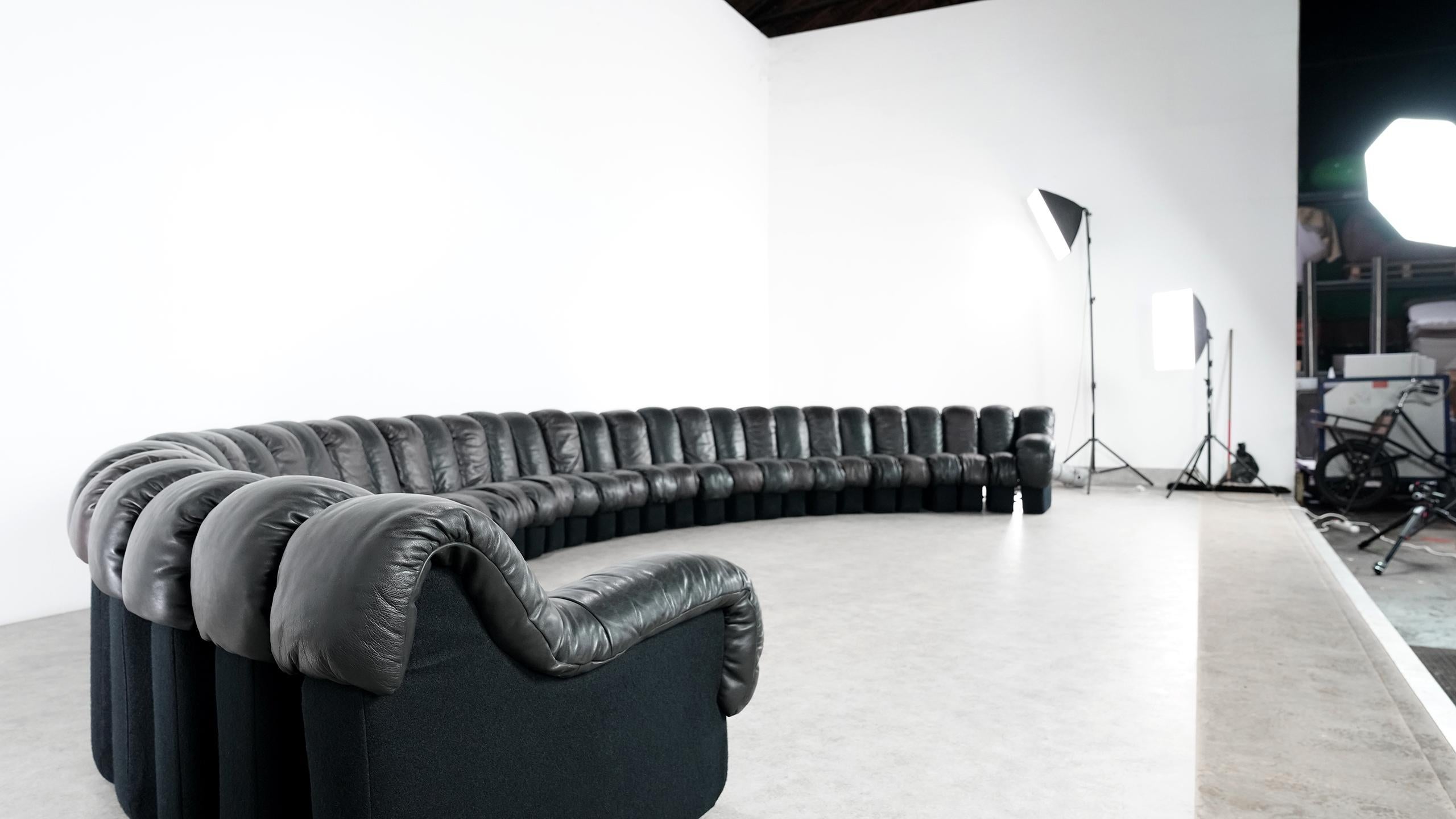 Probably the world's largest legendary De Sede sofa ever - the De Sede DS 600 in black and darkbrown leather.

Design by Ueli bergere, Eleonore Peduzzi-Riva, Heinz Ulrich, Klaus Vogt in 1972. 

The sofa comes from the Munich residence of an art