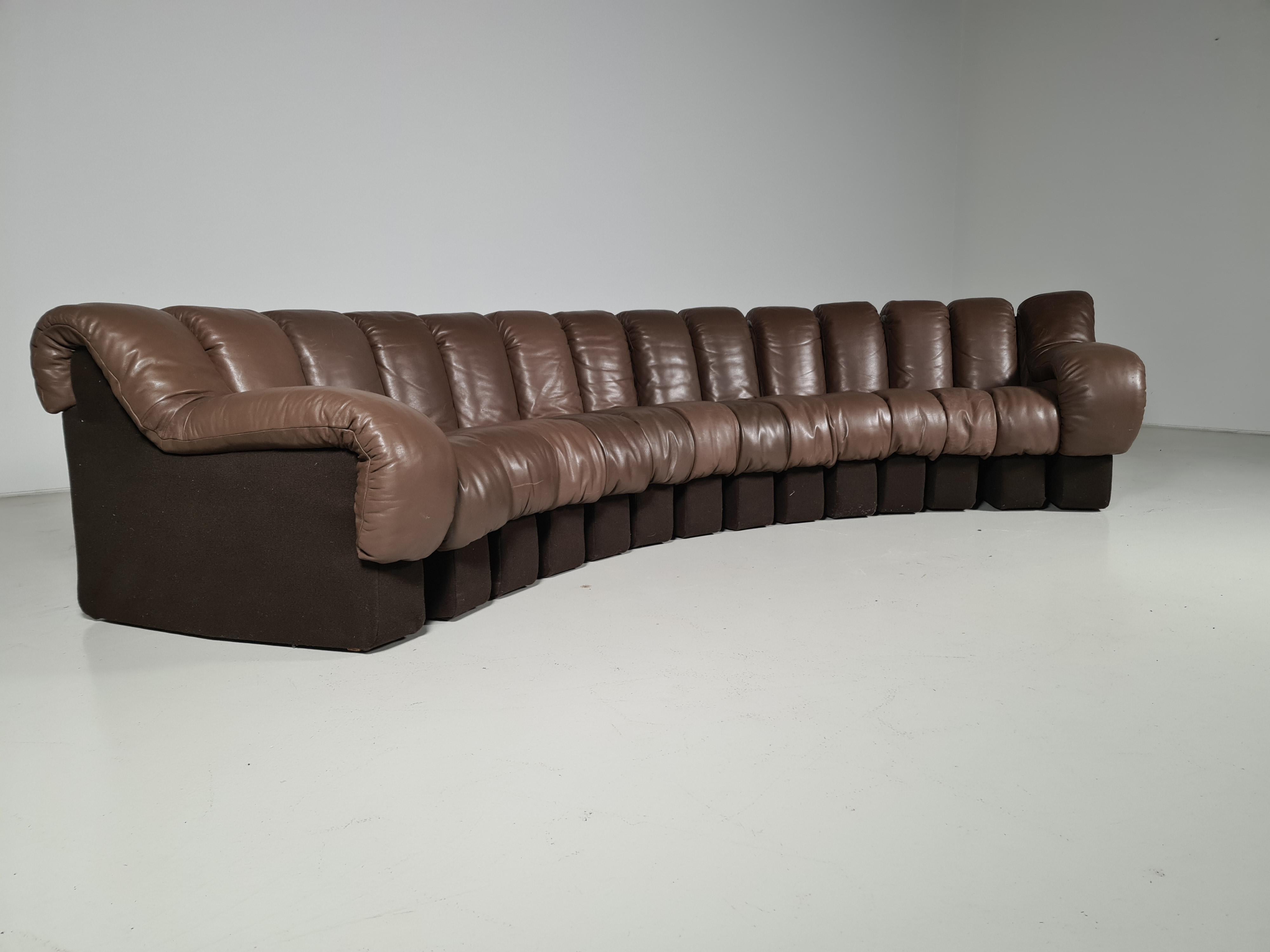 De Sede DS 600 “Non-Stop” sectional leather sofa by Heinz Ulrich, Ueli Berger and Elenora Peduzzi-Riva from the 1970s. Original brown leather seating with brown felt bases. 14 pieces, all of which hook and zip together. We have 2 sofa's available.