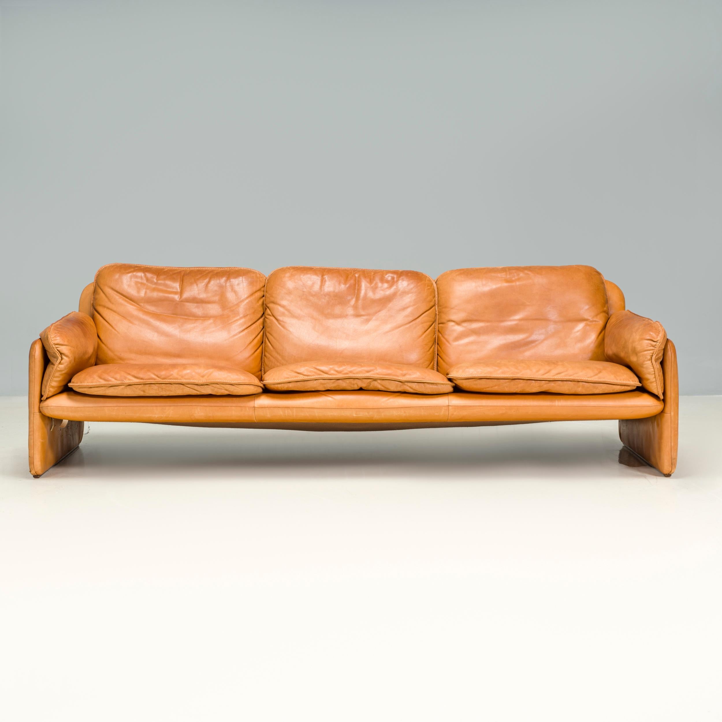 An iconic mid century design, the De Sede DS-61 is no longer in production making it a collectible piece from the furniture manufacturer.

Fully upholstered in soft cedar coloured leather, this three seat sofa features a slimline frame with curved