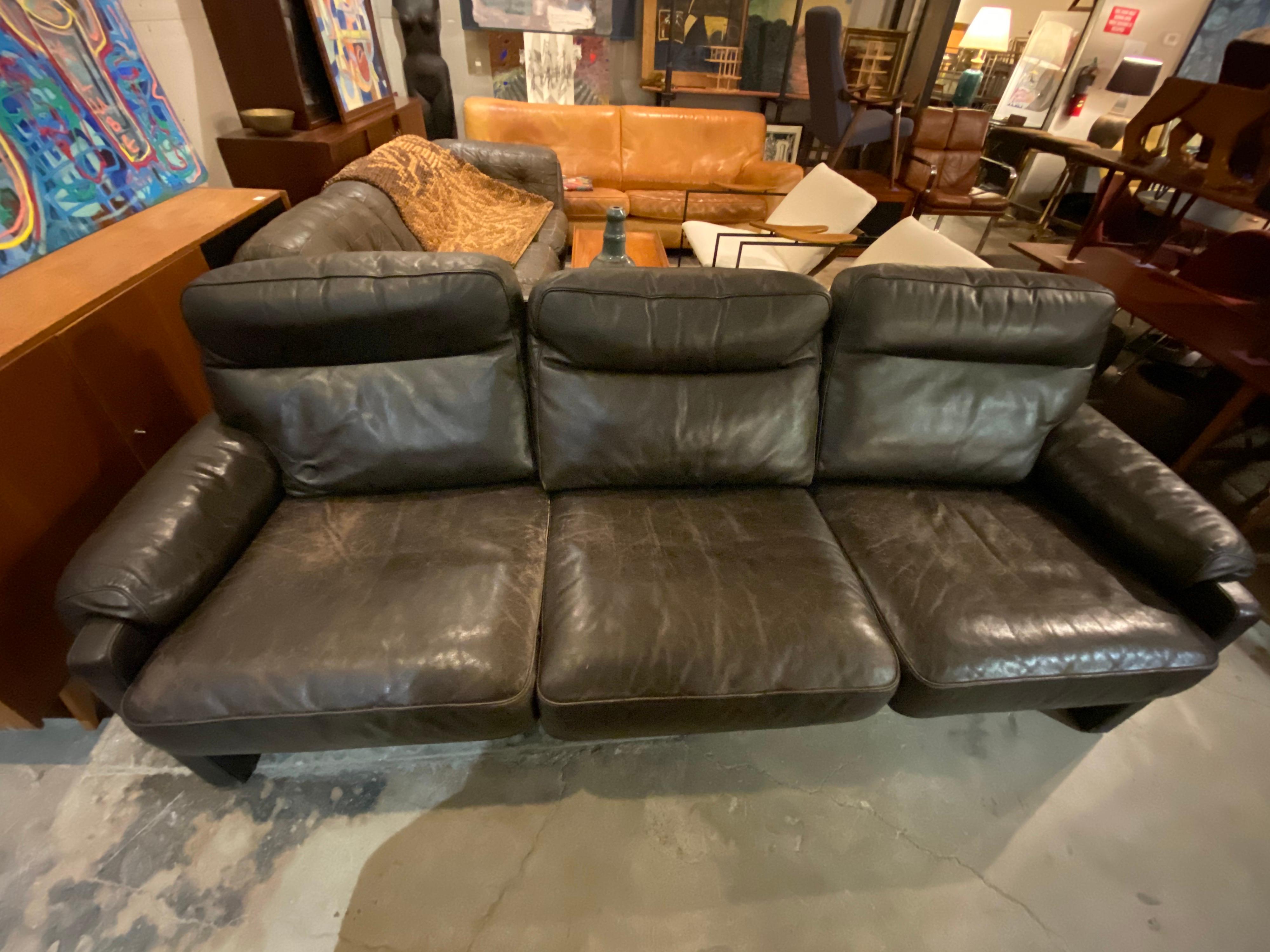 Beautiful Mid-Century Modern De Sede DS-70 sofa in a dark rich brown color (almost black) with patina, circa 1970s, Switzerland. De Sede is renowned for its high-quality, handcrafted luxurious leather furniture, and stunning aesthetics.