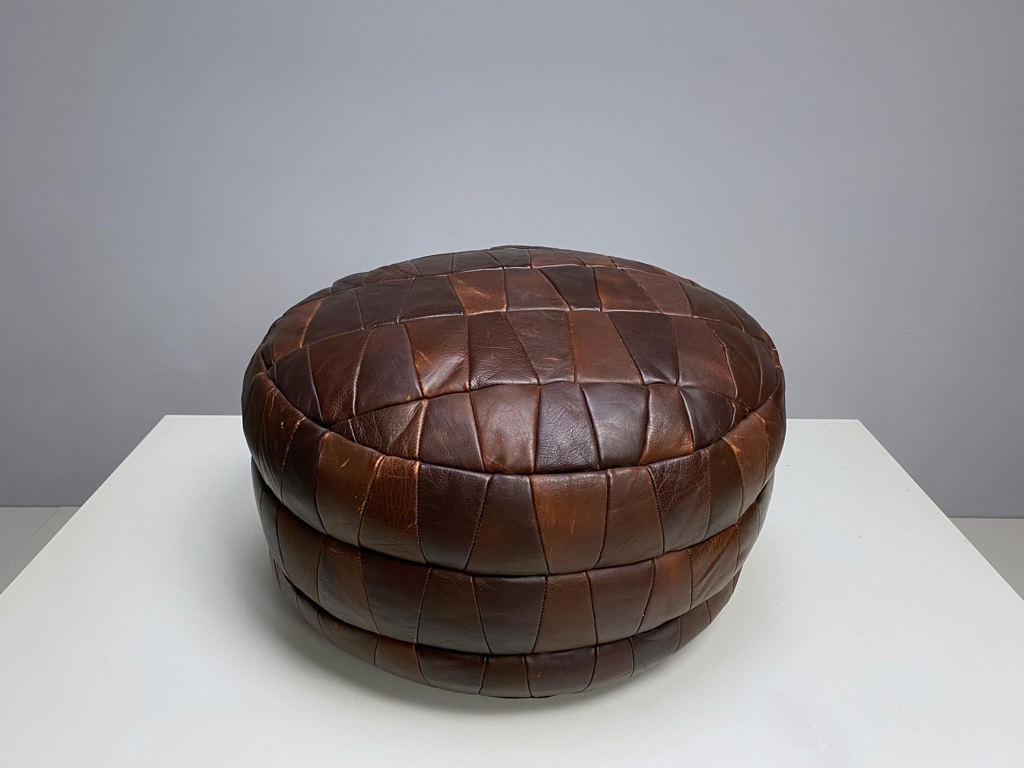Unique and decorative handmade De Sede DS-80 pouf from 1970s. The pouf is in very good condition with lovely patina, high seating comfort.

Detailed condition: Very good, this vintage item has no defects, but it may show slight traces of use. 
 