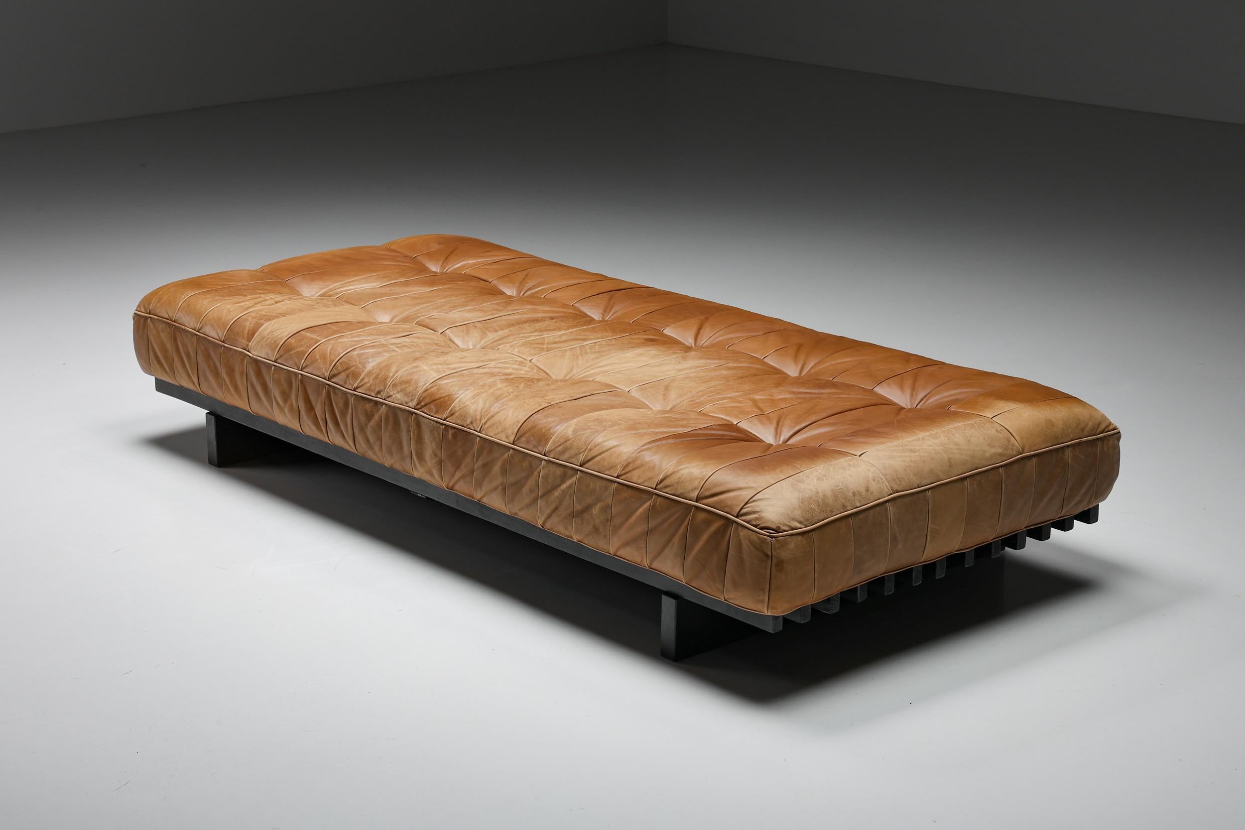 De Sede DS 80 Patchwork Cognac Leather Daybed, Switzerland, 1960's;

Rare and highly desirable modular original daybed that includes three cushions. Hand-built in the 1960s by De Sede craftsman in Switzerland and upholstered in stunning soft