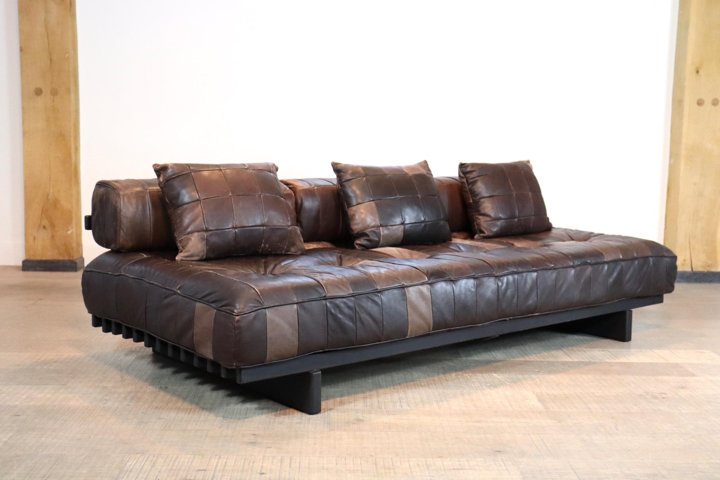 Brown leather patchwork De Sede DS80 daybed with backrests. Originally pholstered in a beautiful and soft aniline leather. It is extremely comfortable. The patina on this daybed is fantastic.