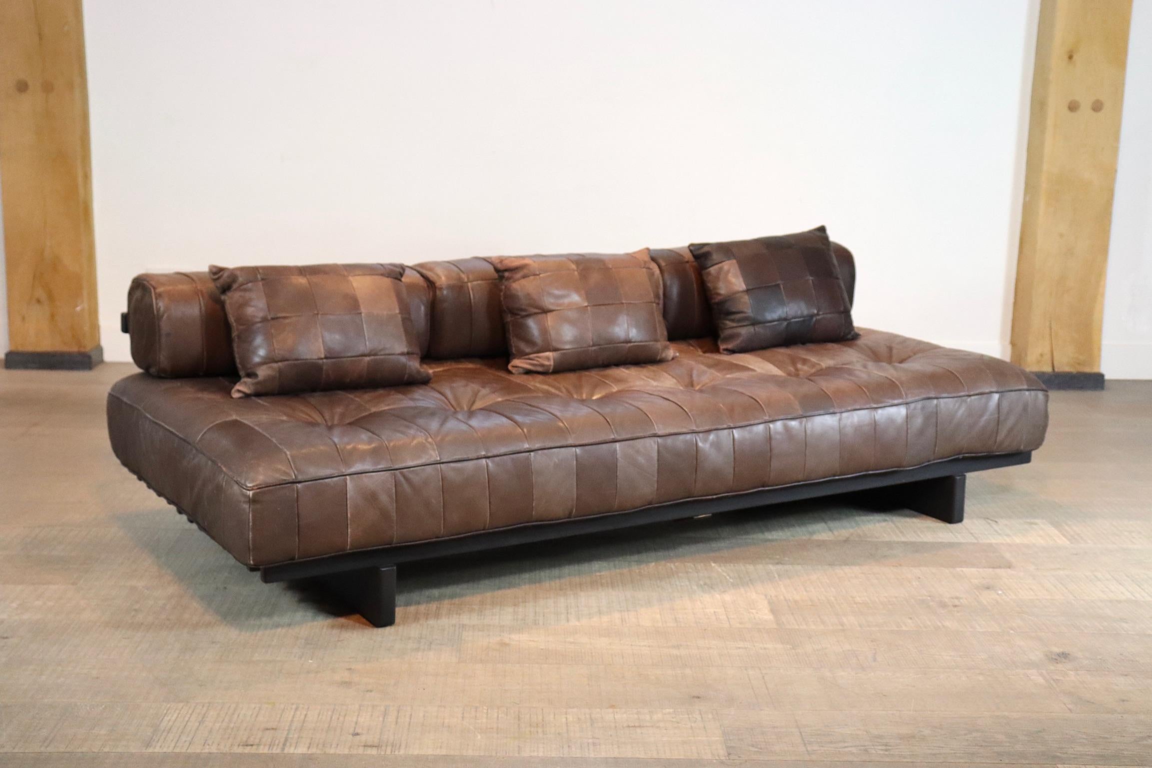 Brown leather patchwork De Sede DS80 daybed with backrests. Originally upholstered in a beautiful and soft aniline leather. It`s extremely comfortable. The patina on this daybed is fantastic.