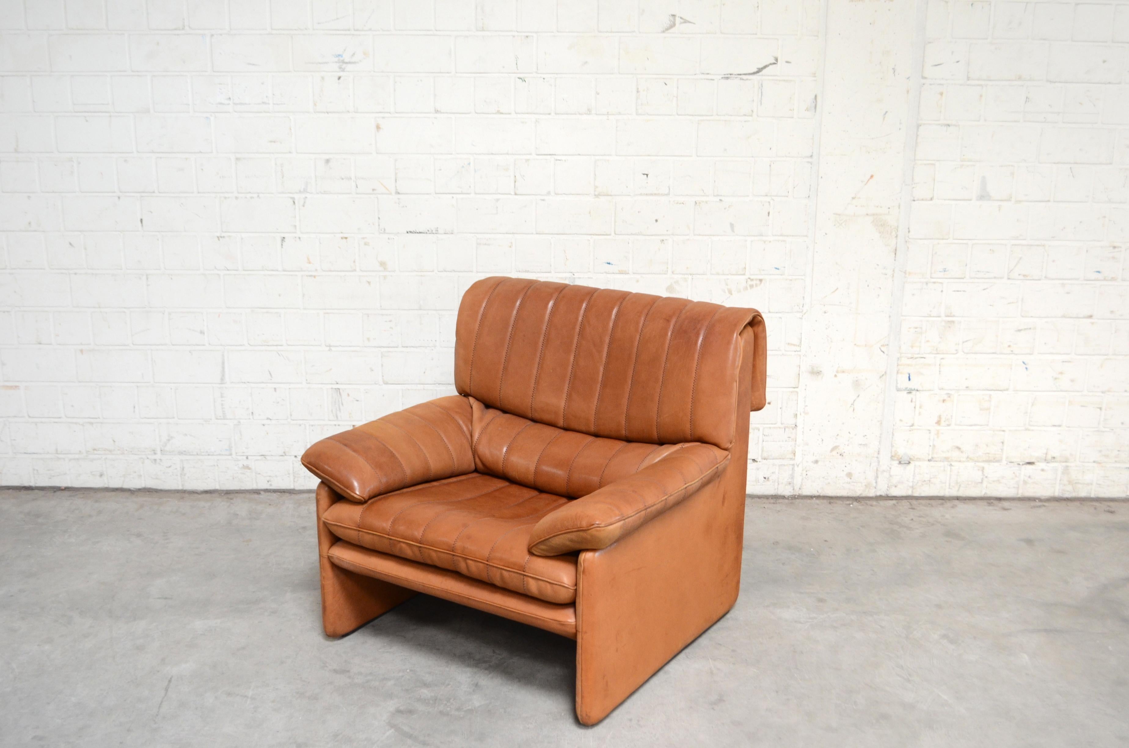 Vintage leather Armchair by De Sede.
Model Ds 86.
Thick neck leather with beautiful cognac color.
Great comfort.
With patina. On the left side the leather color is faded also the back.
De Sede is a Switzerland furniture company that creates