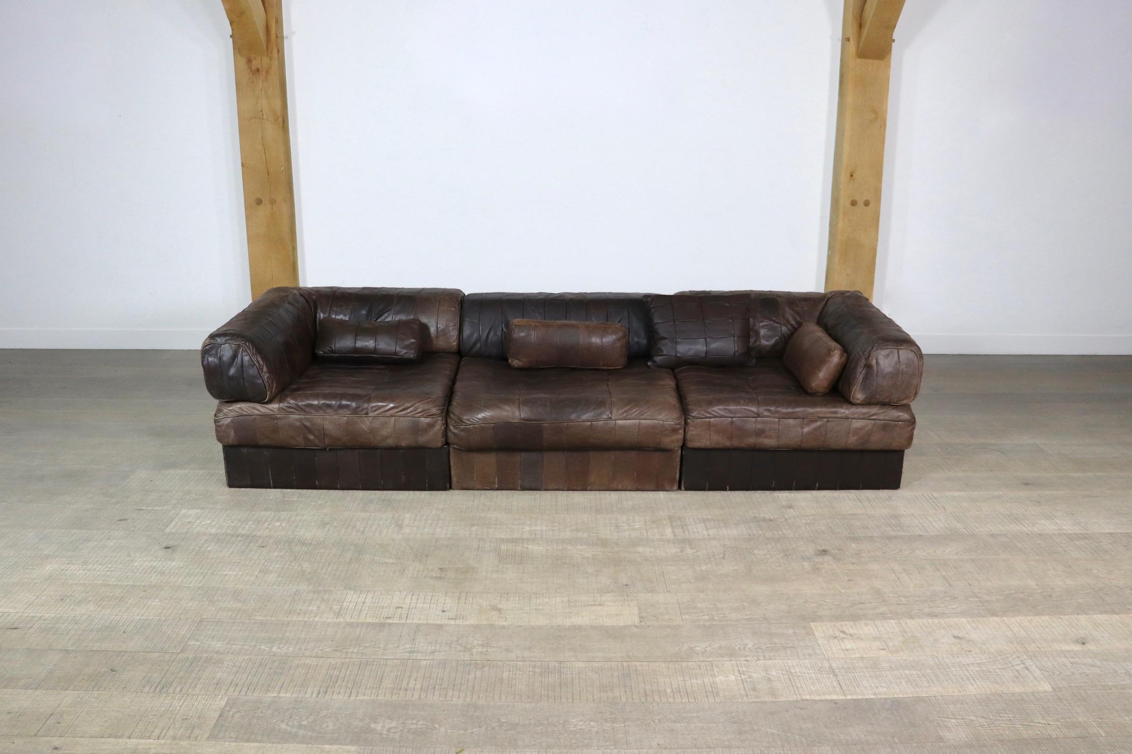 Beautiful DS-88 patchwork leather sofa designed and manufactured by De Sede, Switzerland 1970s. The sofa consists of 3 elements, of which one corner, each with a dark brown leather patchwork base, seating cushion and back cushion made from the same