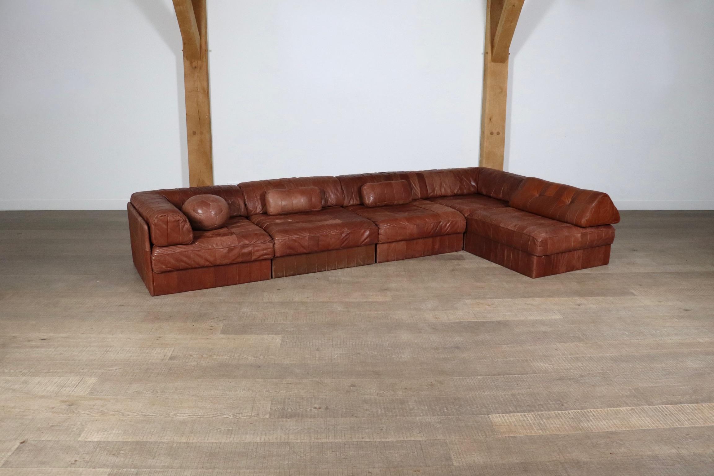 Fantastic DS-88 patchwork leather sofa designed and manufactured by De Sede, Switzerland 1970s.

The sofa consists of five elements, of which two corners, each with a cognac leather patchwork base, seating cushion and back cushion made from the same