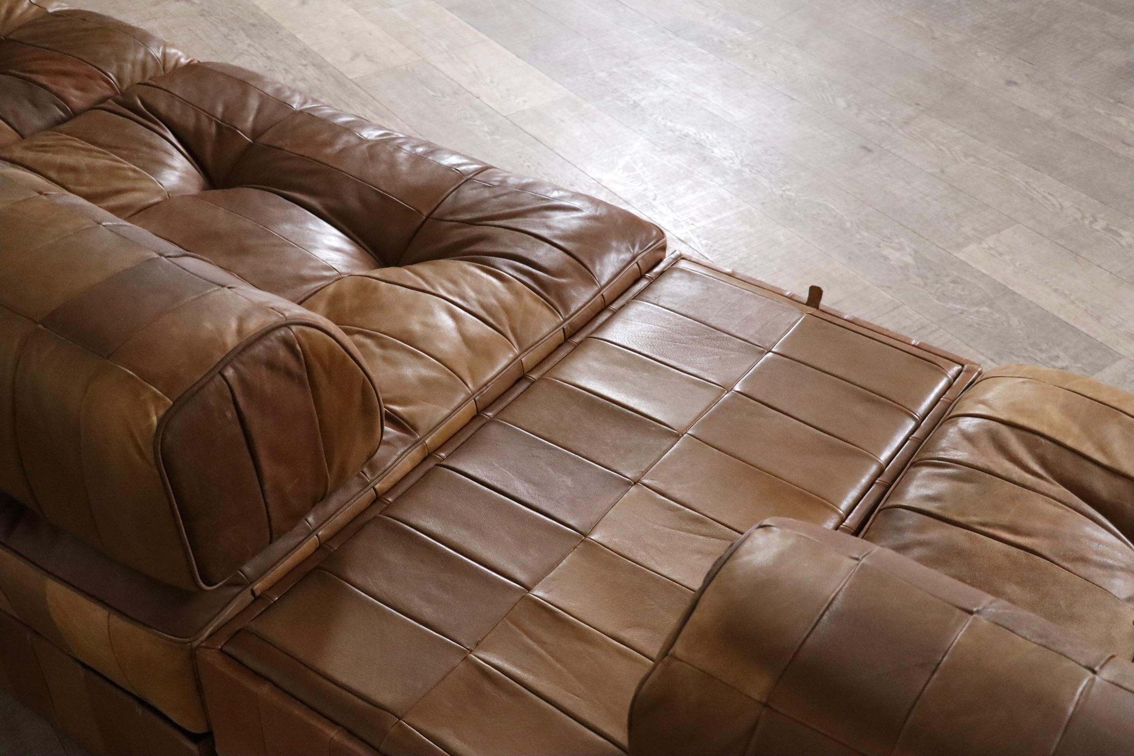 Fantastic DS-88 patchwork leather sofa designed and manufactured by De Sede, Switzerland 1970s.

The sofa consists of four elements, each with cognac leather patchwork base, seating cushion and back cushion made from the same soft leather with a