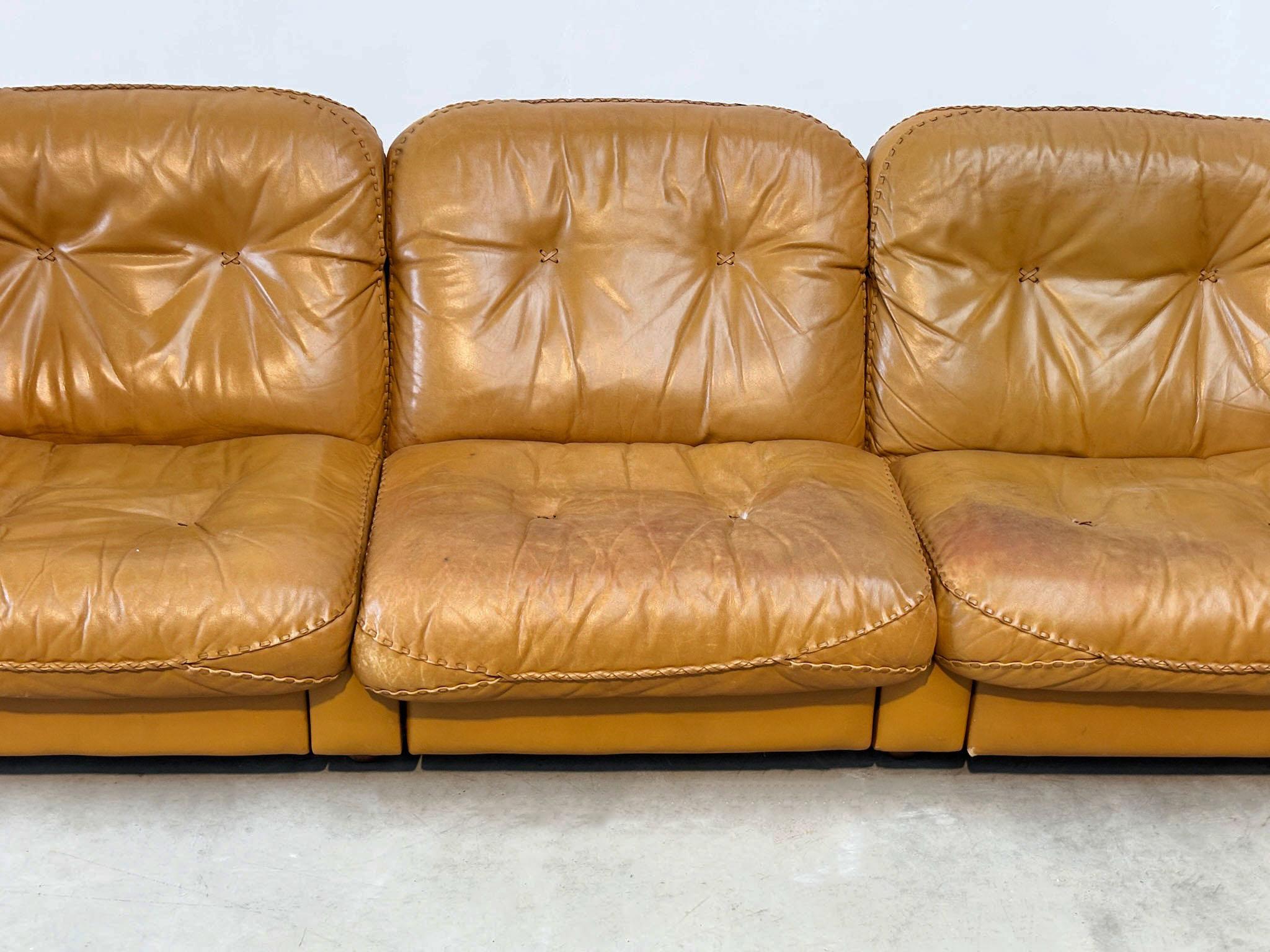 De Sede DS101 three seater in cognac leather
This high-quality comfort three-seater, designed for De Sede in the 1970s, features extendable individual seats perfect for lounging. Upholstered in rich cognac leather, the sofa boasts a beautiful patina