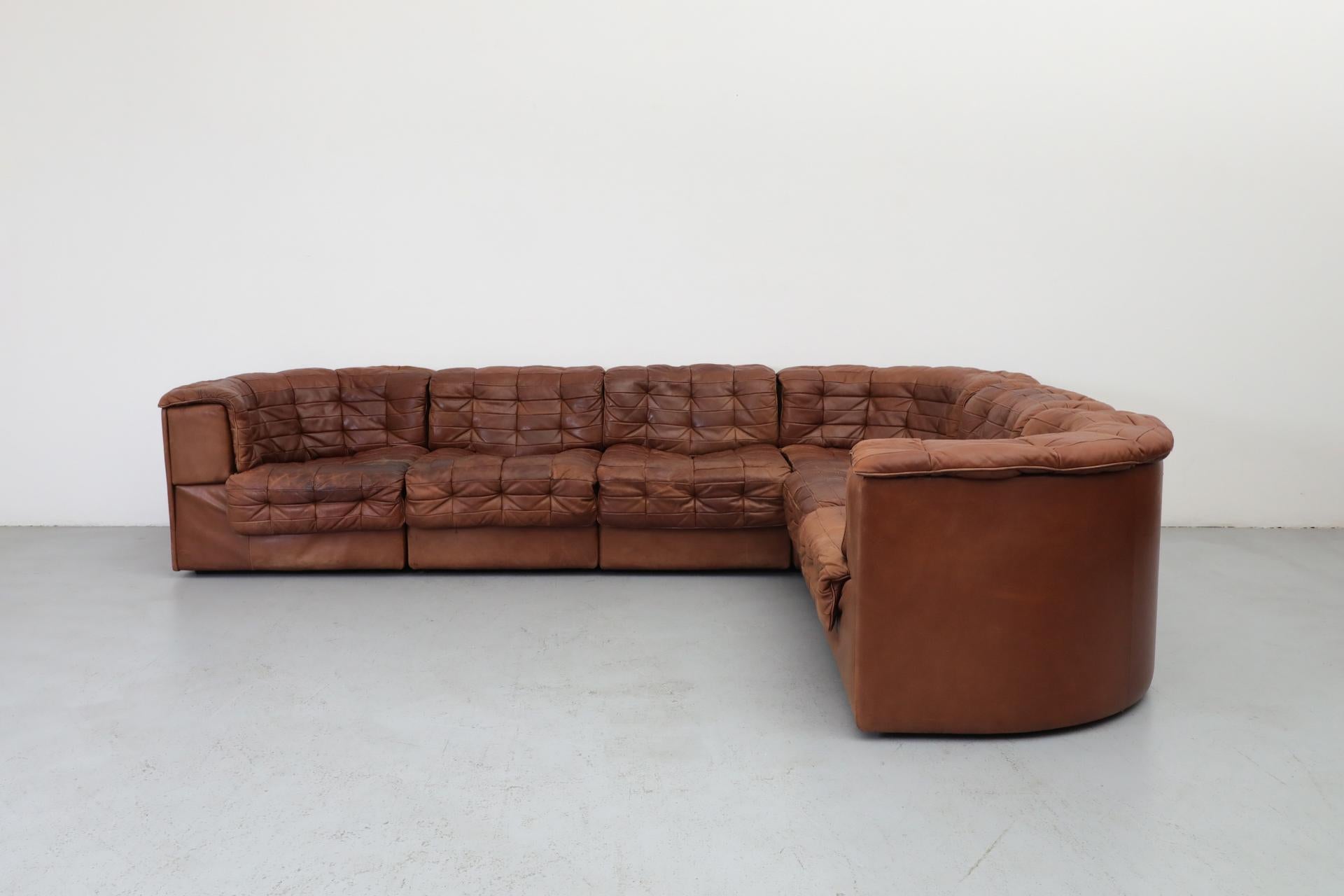 De Sede DS11 cognac patchwork leather, modular sofa with three corner pieces and three single seats. Extremely comfortable and elegant from every angle. Corner pieces are 31