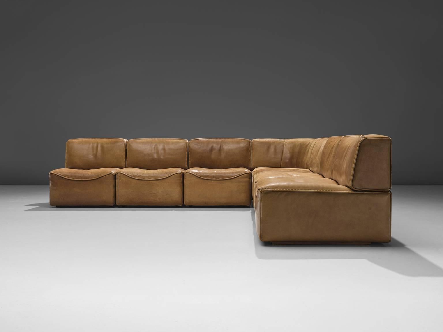 De Sede, sectional sofa model DS-15, seven elements, cognac leather, Switzerland, 1970s. 

This sectional sofa contains one corner element and six normal elements. The separate elements make it possible to arrange this sofa to your own wishes. The