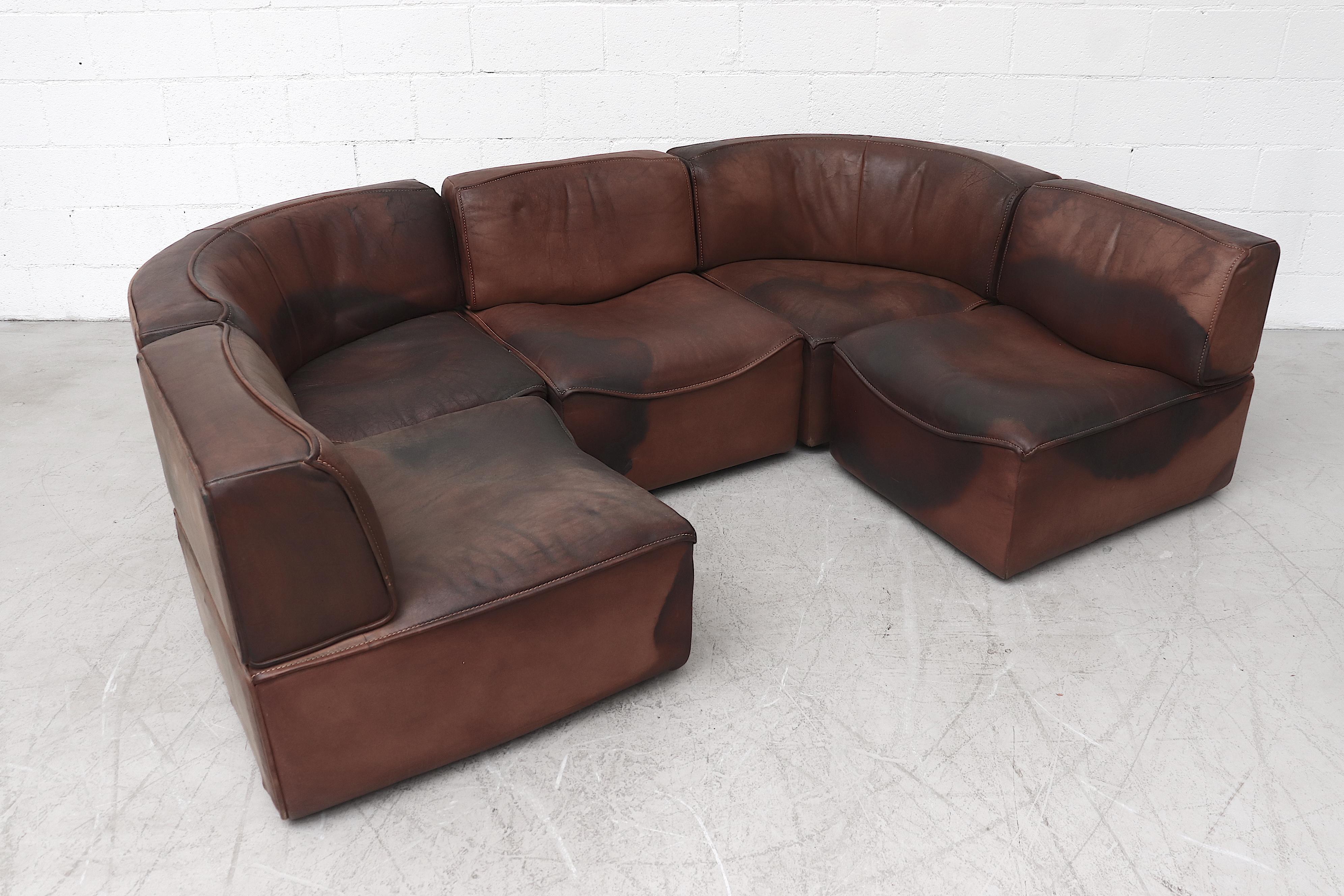 Gorgeous well loved De Sede 'DS15' five section buffalo leather sofa. Consisting of two corner seats and three straight sections that allow for multiple configurations. Handsome sectional with nice heavy patina and visible wear. In original