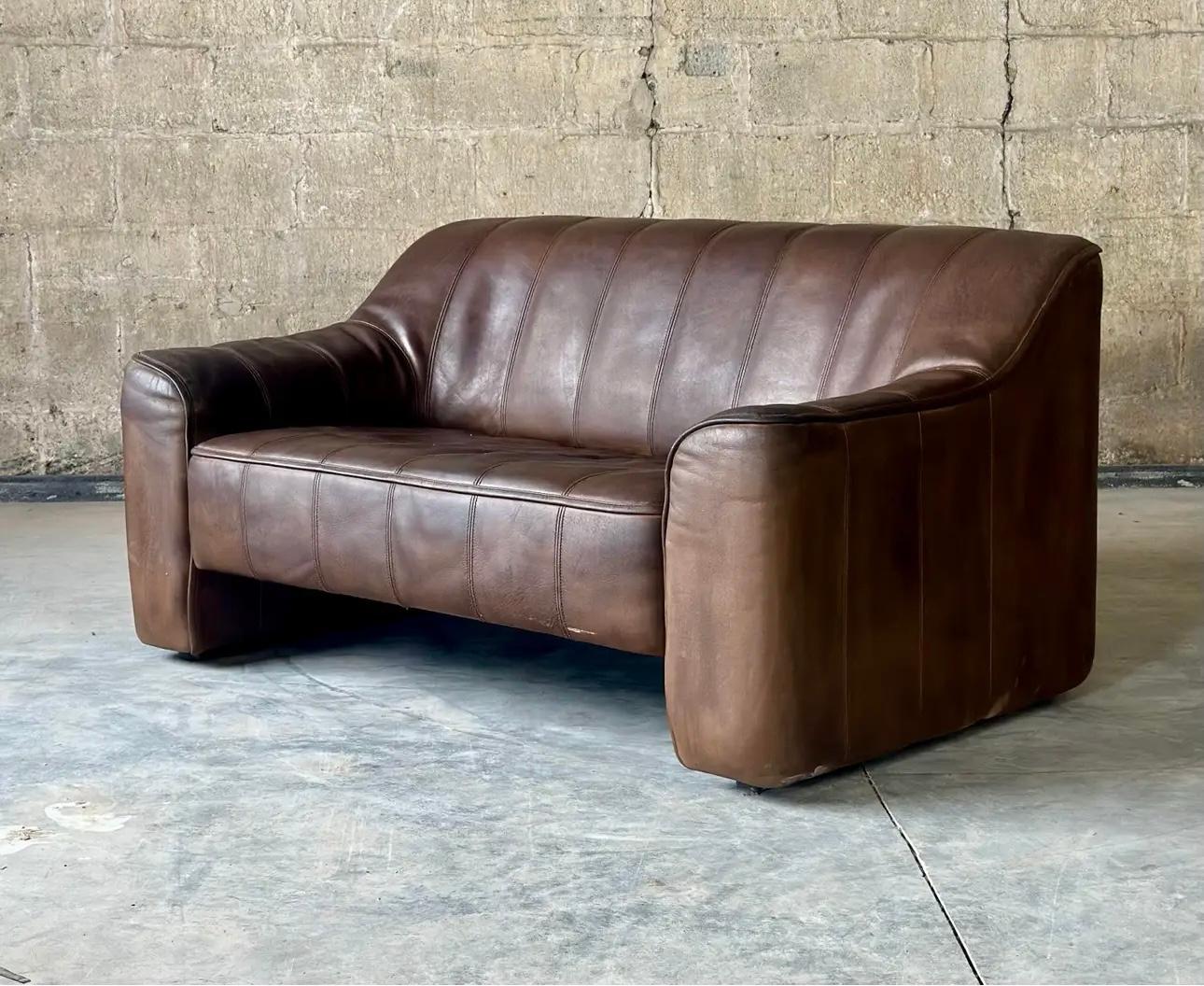 Form and function with this De Sede DS44 loveseat. The Buffalo leather is strong and SO comfortable, and it reclines. 

The Swiss manufacturer De Sede has been producing luxury furniture with the highest craftsmanship and timeless designs since