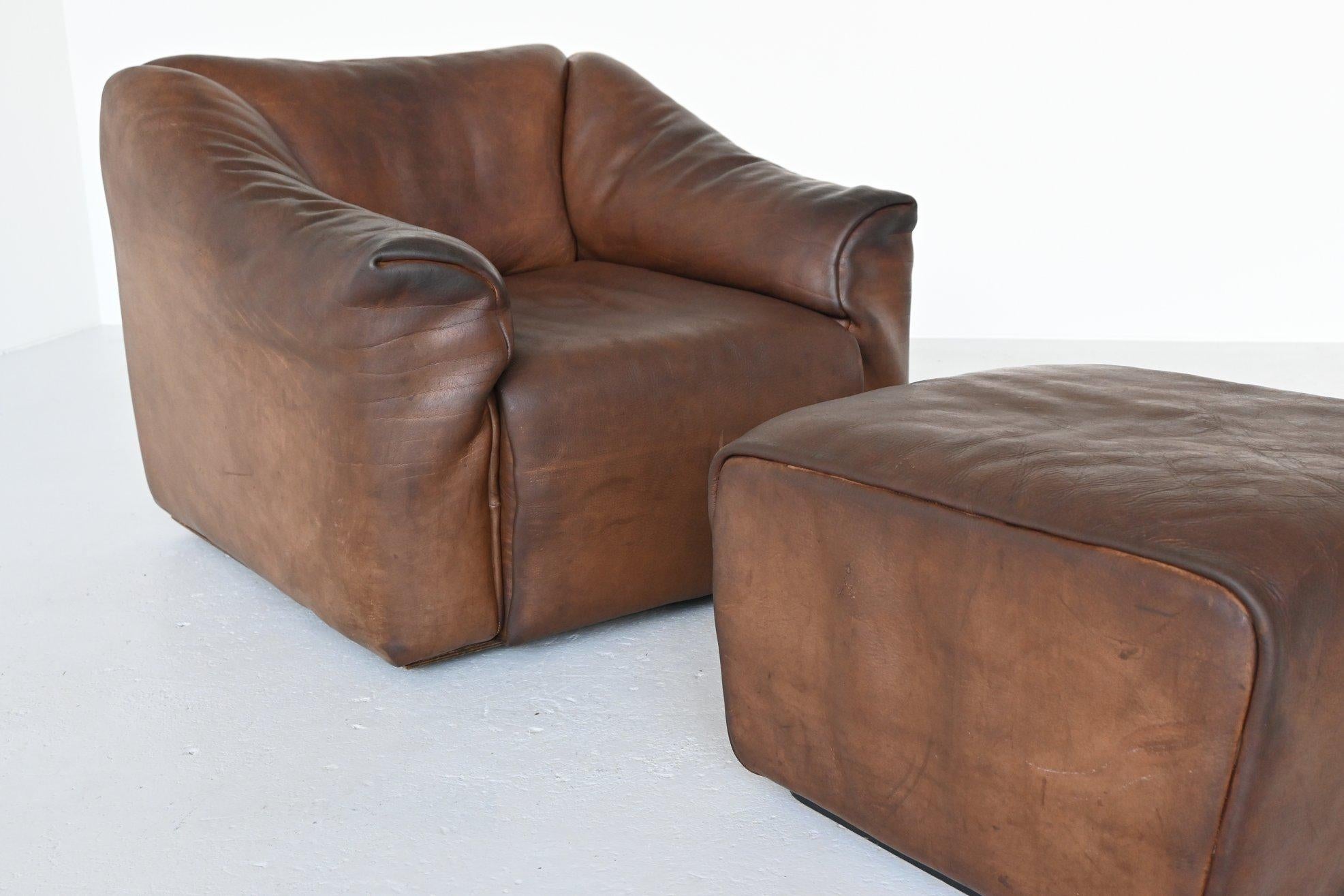 Very comfortable DS47 armchair with ottoman designed and manufactured by De Sede, Switzerland, 1970. This set is made of high quality brown buffalo leather. De Sede is known for its supreme quality leather and comfort seating. The armchair has the