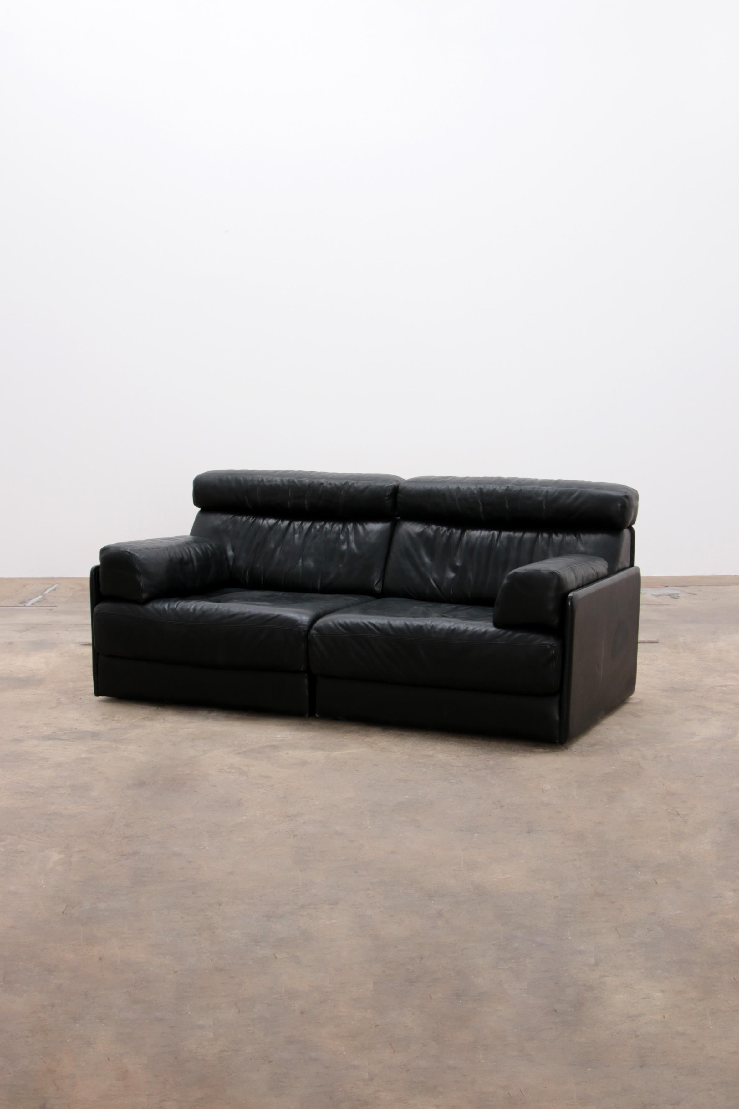 De Sede DS76 Two-Seat Sofa Bed in Black Upholstery by De Sede Design Team
Beautiful black leather sofa with the option of easily turning it into a bed.

DS-76 was launched way back in 1972, when it was considered revolutionary. 
No sofa bed could do