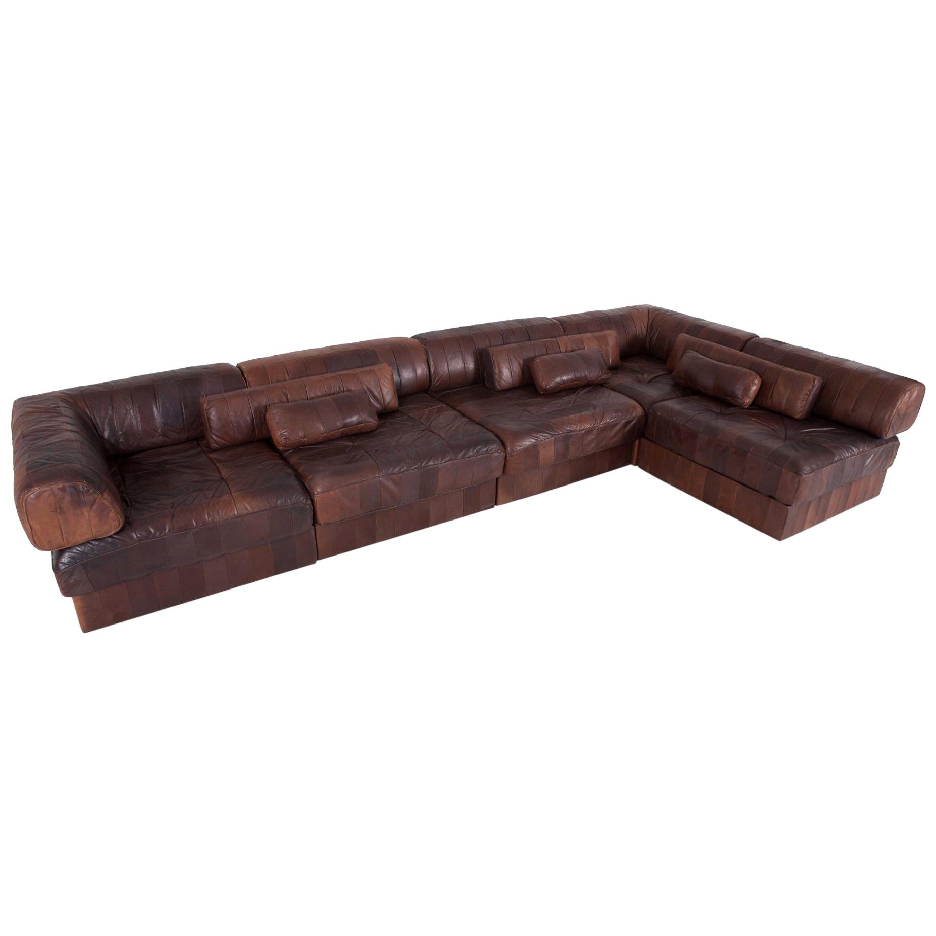 Patchwork brown leather sectional couch, De Sede Switzerland, model DS 88

Hand built in the 1970s to incredibly high standards by De Sede craftsman in Switzerland. Made of five sections, each with a base leather patchwork cushion and a back