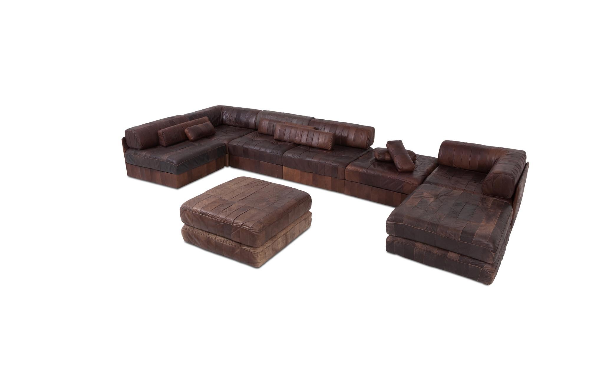 DS 88 sectional sofa in patchwork brown-cognac leather. 

Hand built in the 1970s to incredibly high standards by De Sede craftsman in Switzerland. Made of five sections, each with a base leather patchwork cushion and a back cushion made from the