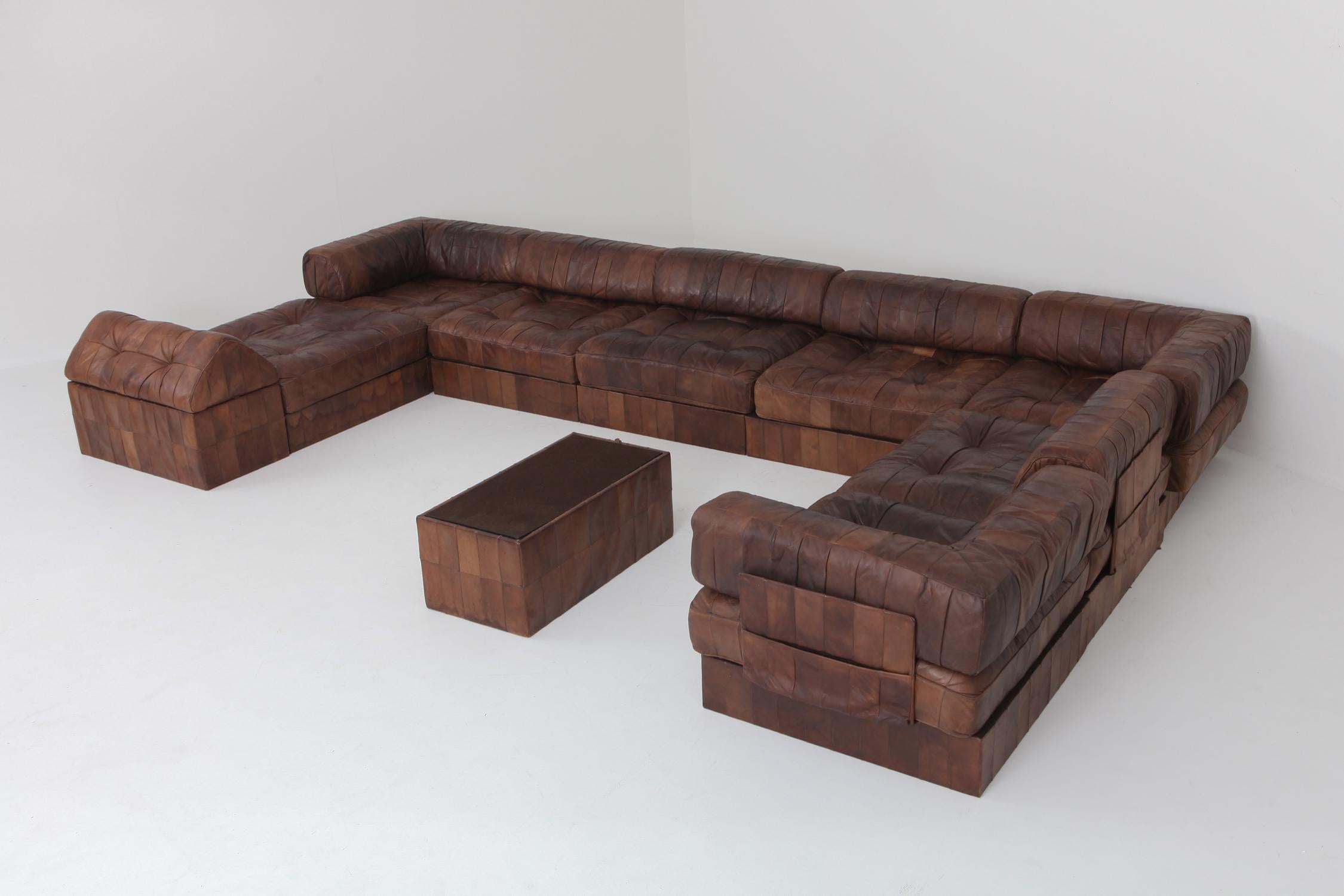 DS 88 sectional sofa in patchwork brown-cognac leather. 

Hand built in the 1970s to incredibly high standards by De Sede craftsman in Switzerland. Made of eight sections, each with a base leather patchwork cushion and a back cushion made from the