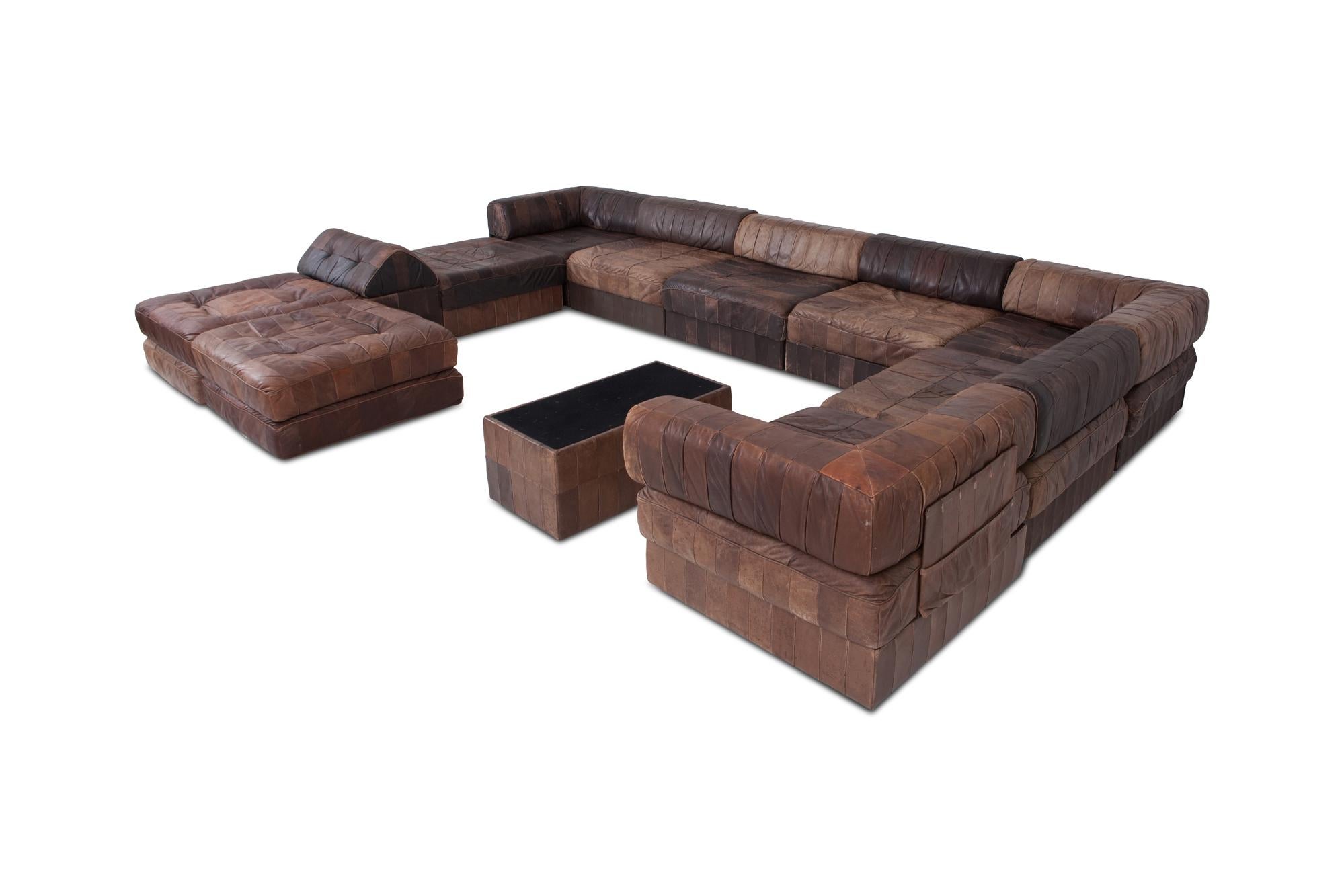 DS 88 sectional sofa in patchwork brown-cognac leather.
Hand built in the 1970s/1980s to incredibly high standards by De Sede craftsman in Switzerland.

Made of eight sections, each with a base leather patchwork cushion and a back cushion made from