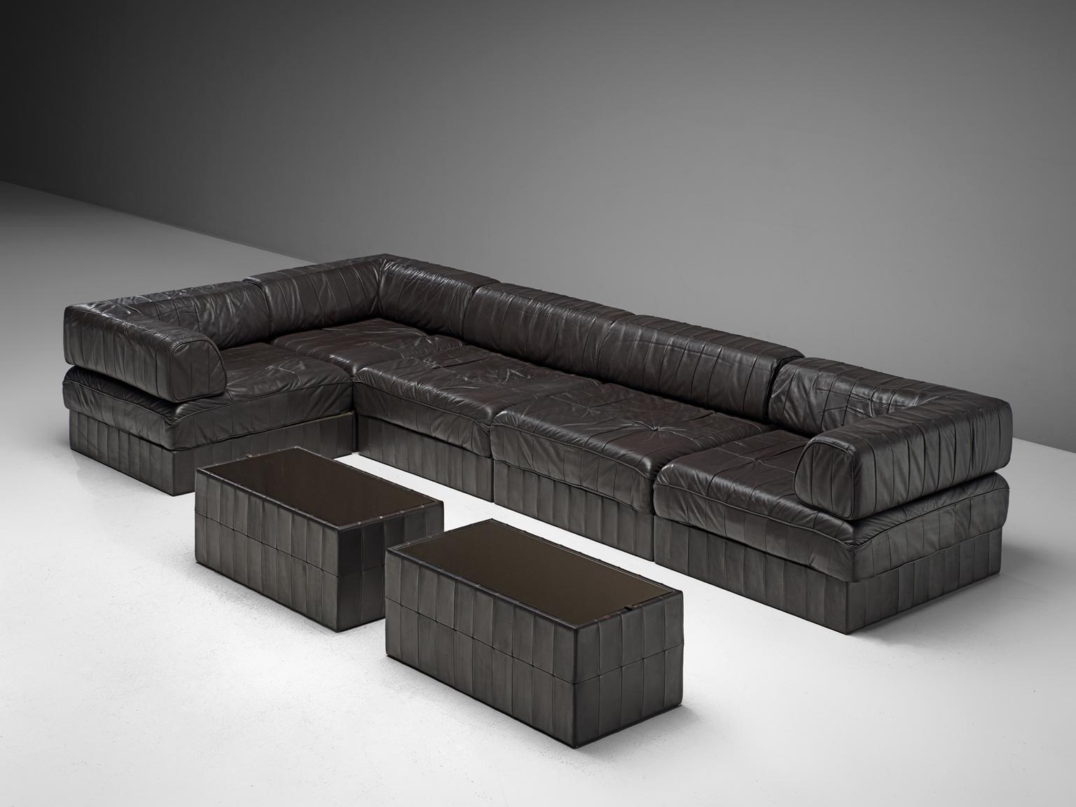 De Sede, sectional sofa, DS 88, dark brown leather, 1970s. 

This comfortable leather sofa is manufactured by De Sede in Switzerland. This sofa consists of five elements, with two additional ottomans/poofs. The cushions are upholstered with the